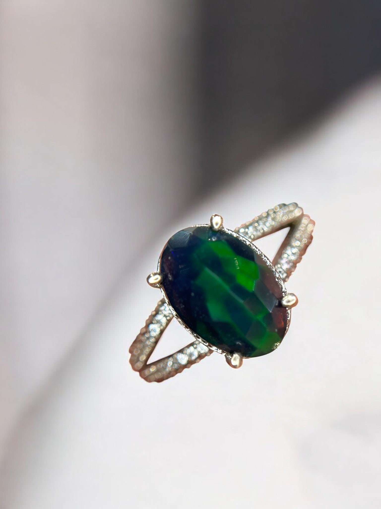 Aurora Borealis: Oval Black Opal Cocktail Ring with Pavé Split Band