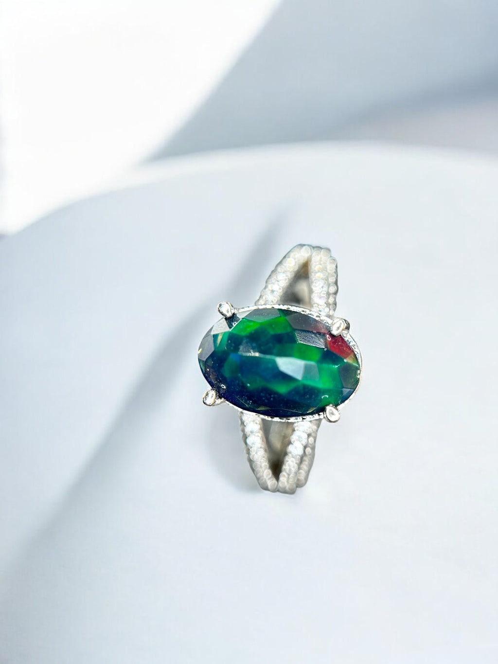Aurora Borealis: Oval Black Opal Cocktail Ring with Pavé Split Band
