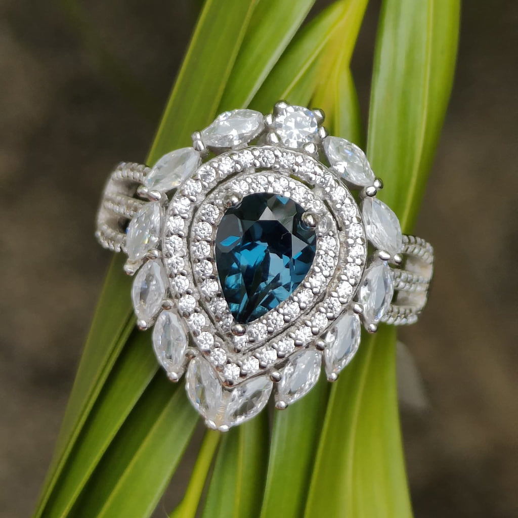 Inky Depths: Natural London Blue Topaz & CZ Statement Ring with Marquise Halo