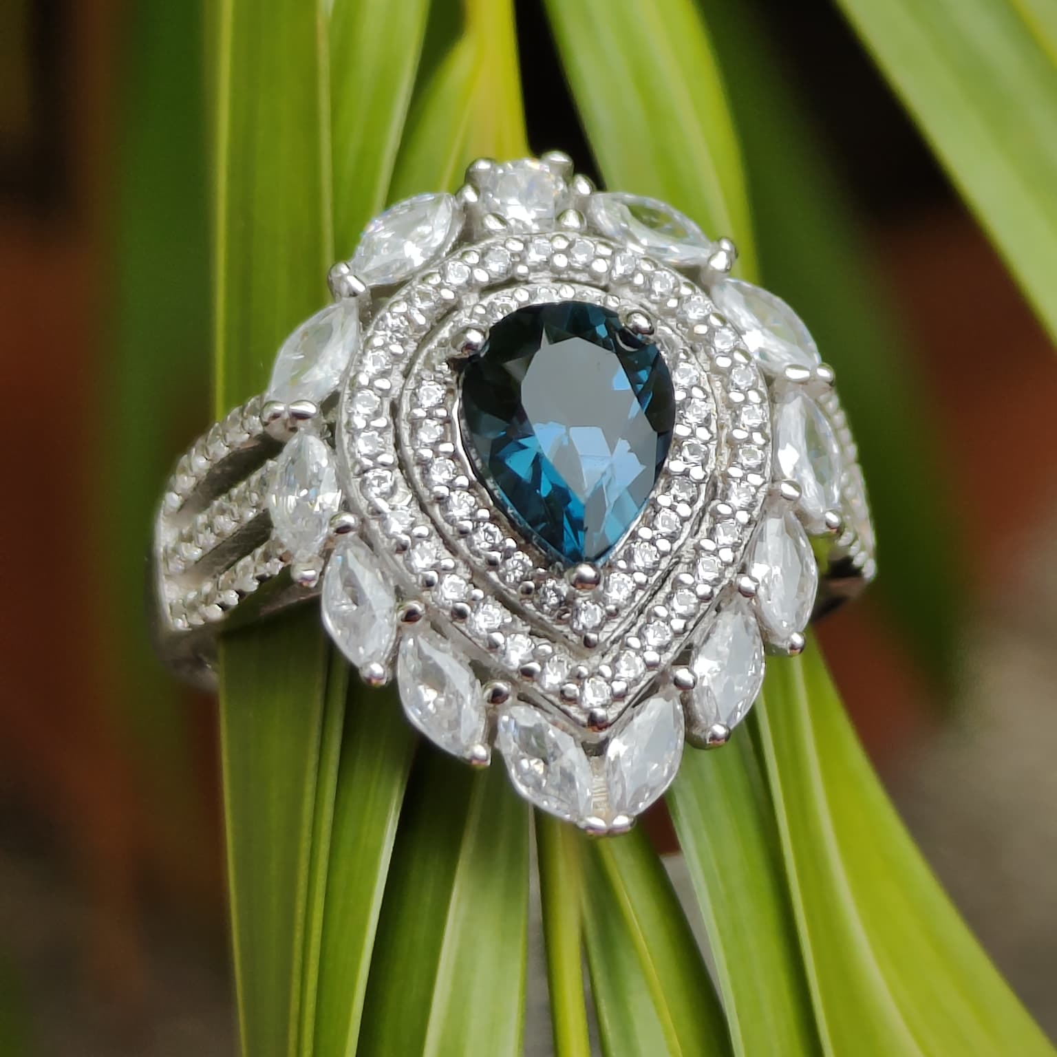Inky Depths: Natural London Blue Topaz & CZ Statement Ring with Marquise Halo