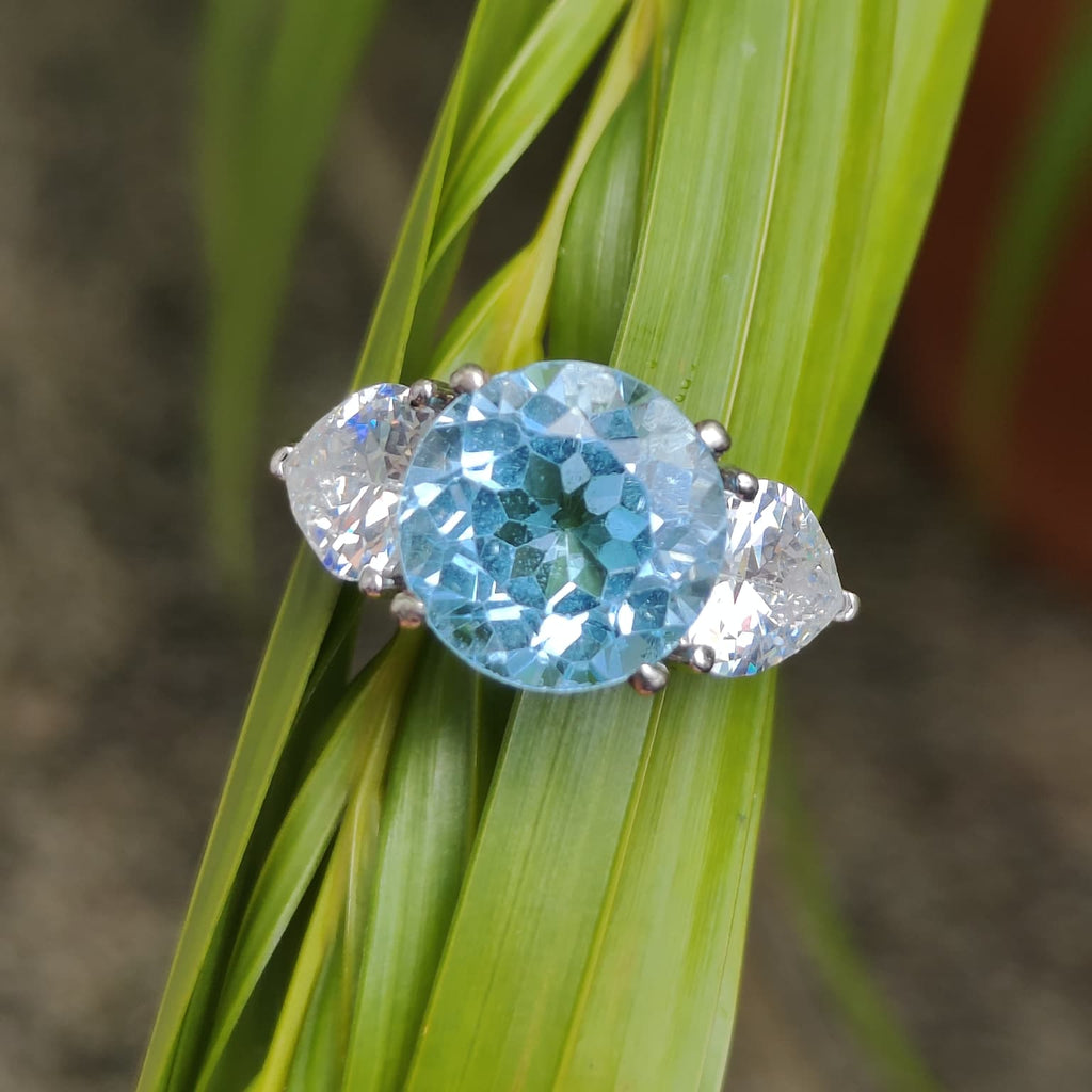 Classic Serenity: Natural Sky Blue Topaz Three-Stone Ring in 925 Silver