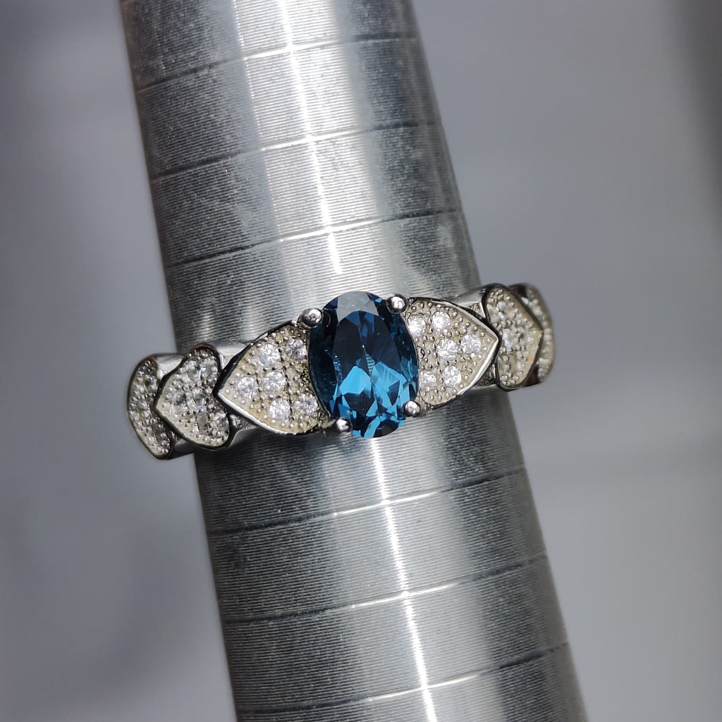 Ocean Heartbeat: Natural London Blue Topaz Ring with CZ Pavé Heart Accents in 925 Silver
