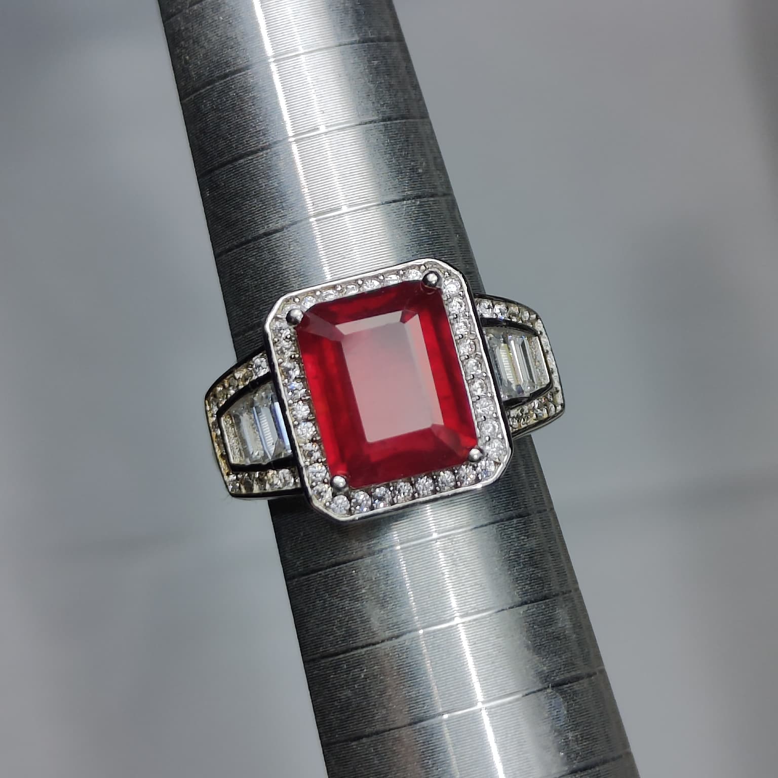 Crimson Statement: Natural Emerald-Cut Ruby Ring with Geometric CZ Halo in 925 Silver