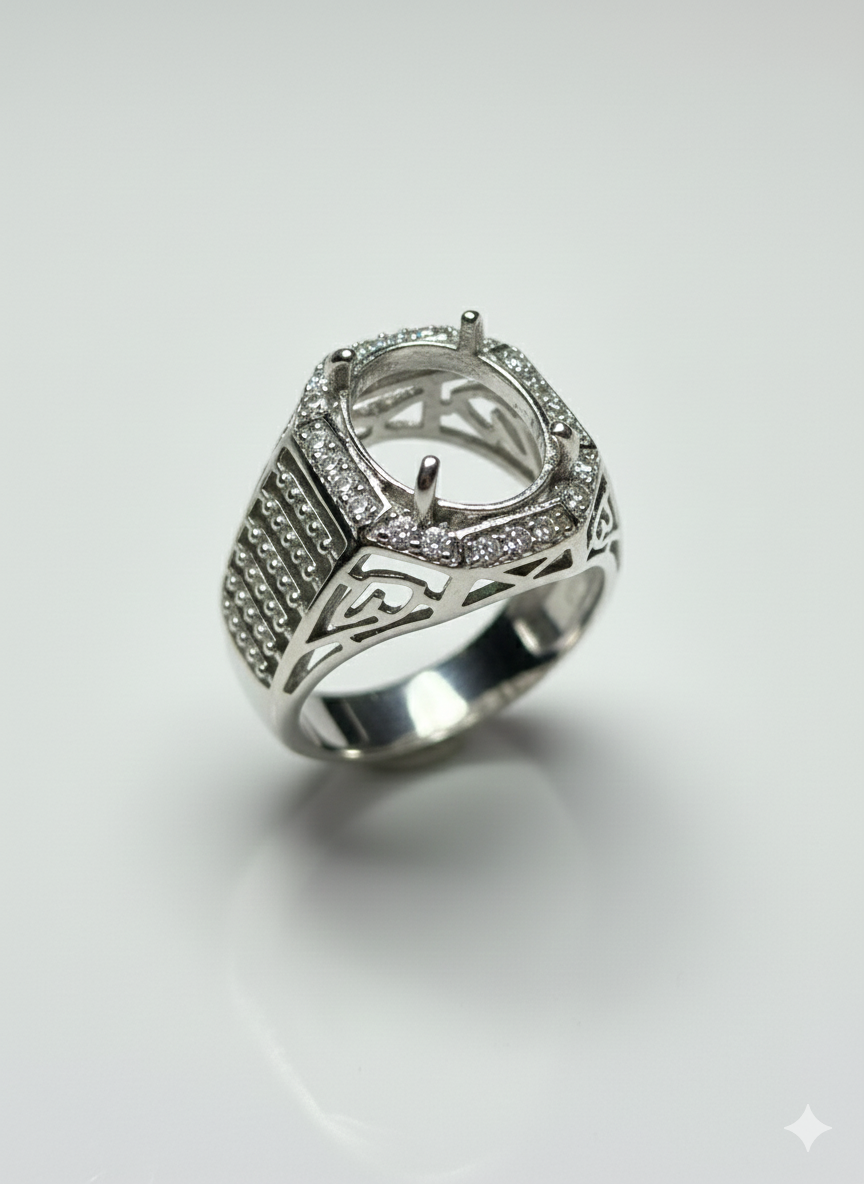 Silver ring with intricate design on a white background