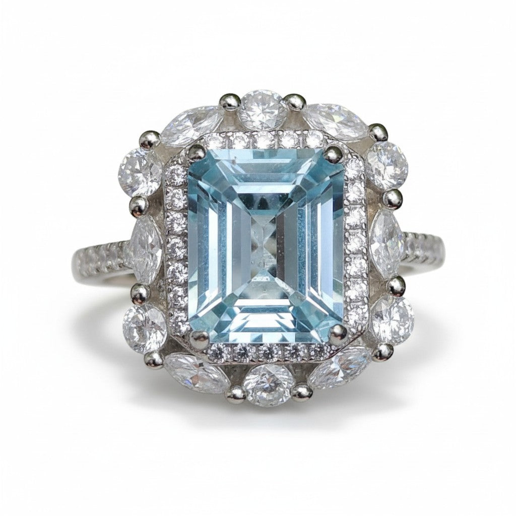 Iceberg Brilliance: Natural Sky Blue Topaz Emerald-Cut Ring with Marquise Halo in 925 Silver