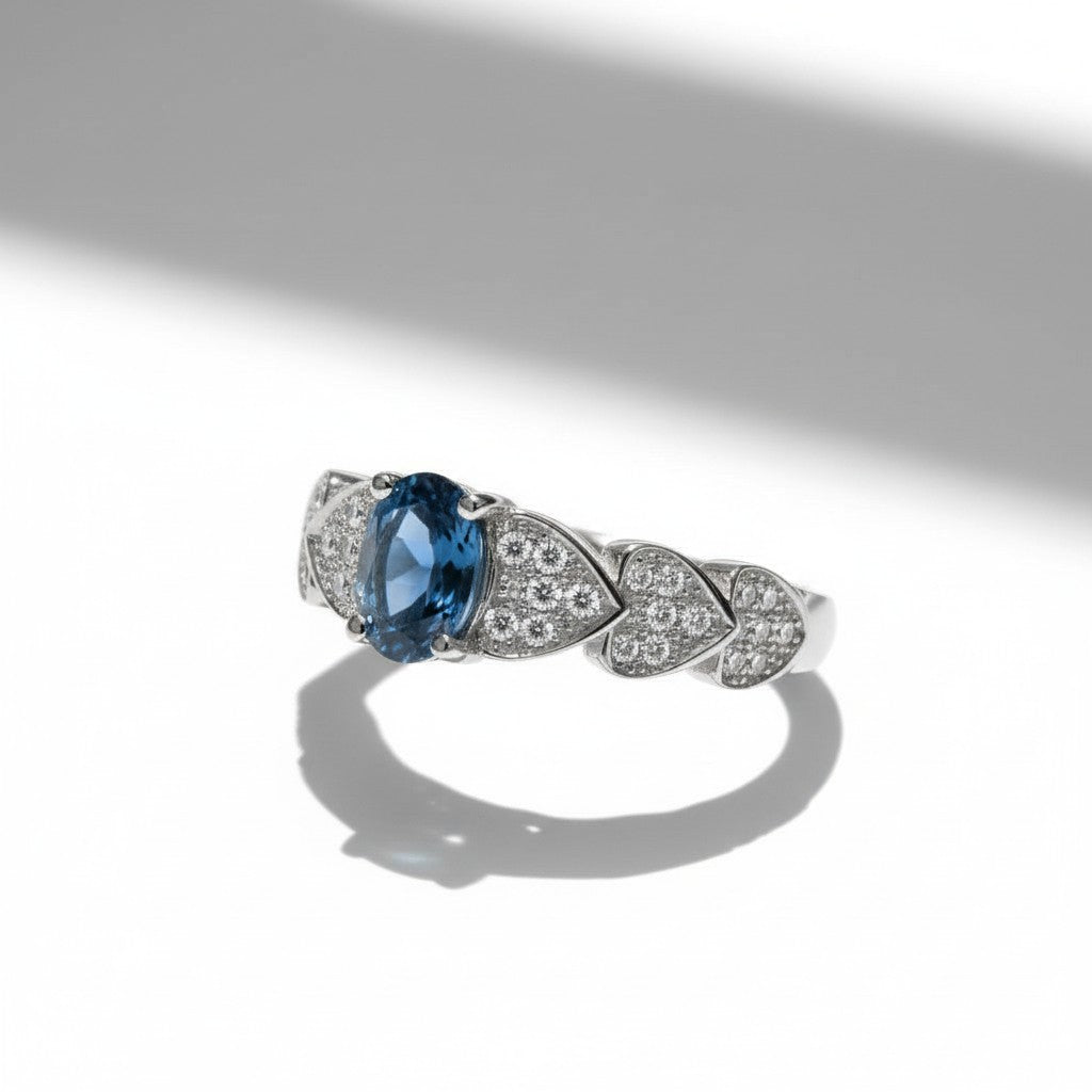 Ocean Heartbeat: Natural London Blue Topaz Ring with CZ Pavé Heart Accents in 925 Silver