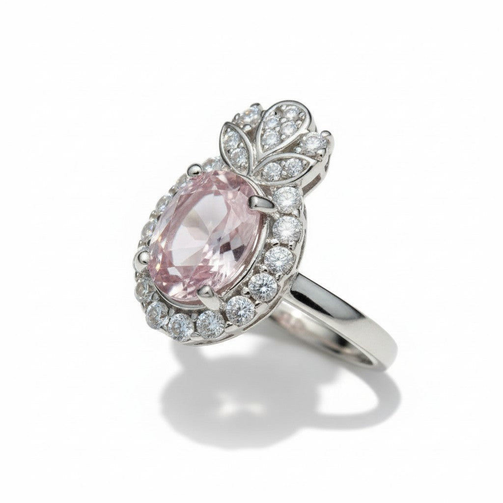 Silver ring with a pink gemstone on a white background