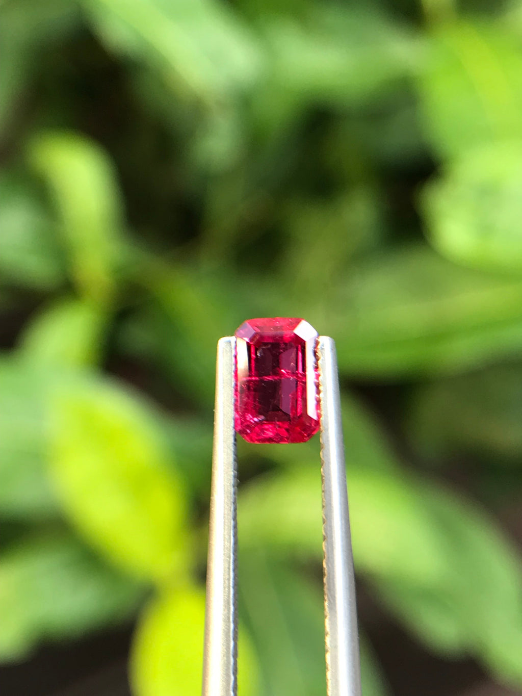 Shiza Gems 1.00 ct emerald cut vivid red Pigeon Blood ruby, unheated, CGRL certified, Mozambique origin.