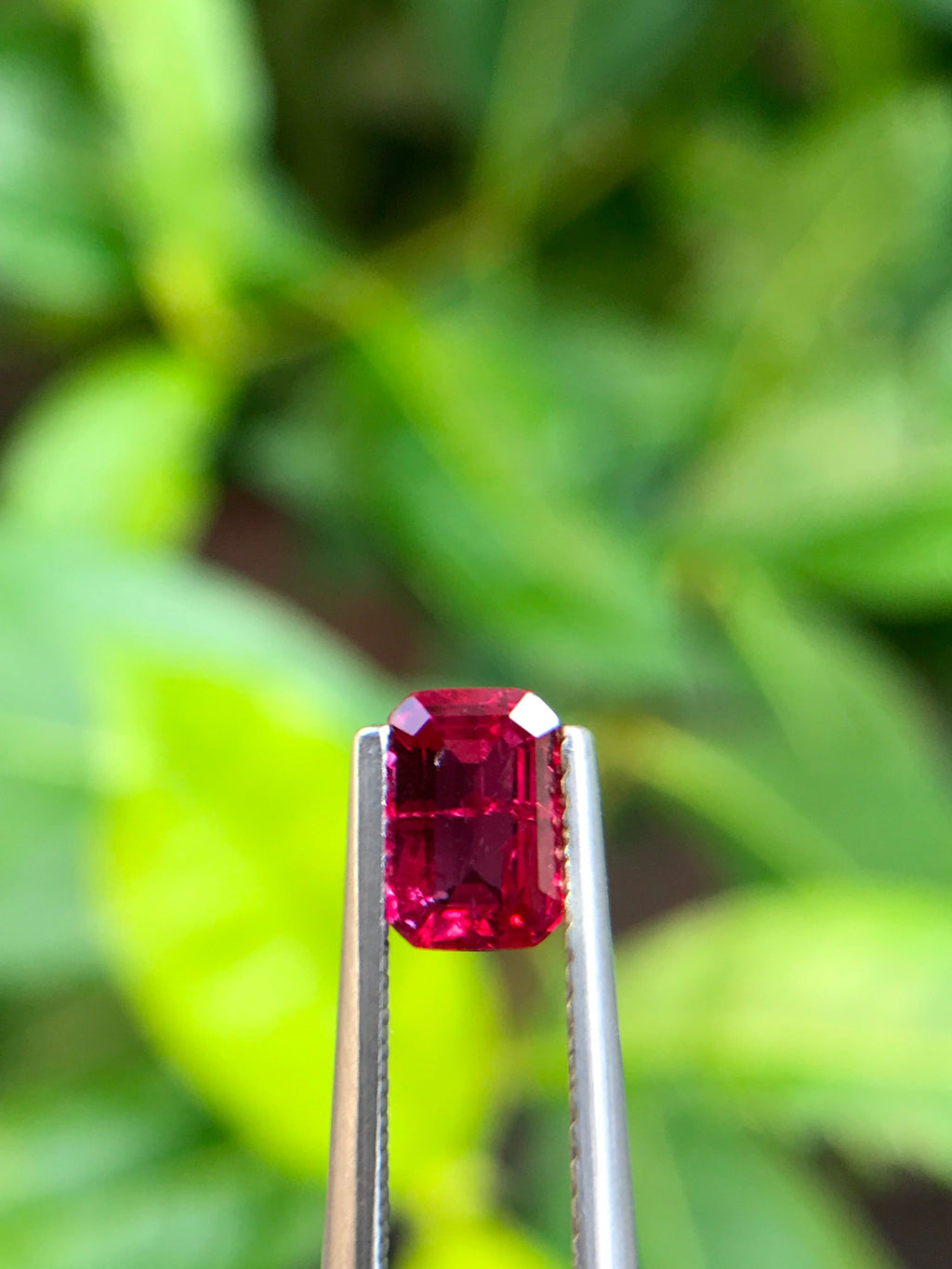 Shiza Gems 1.00 ct emerald cut vivid red Pigeon Blood ruby, unheated, CGRL certified, Mozambique origin.