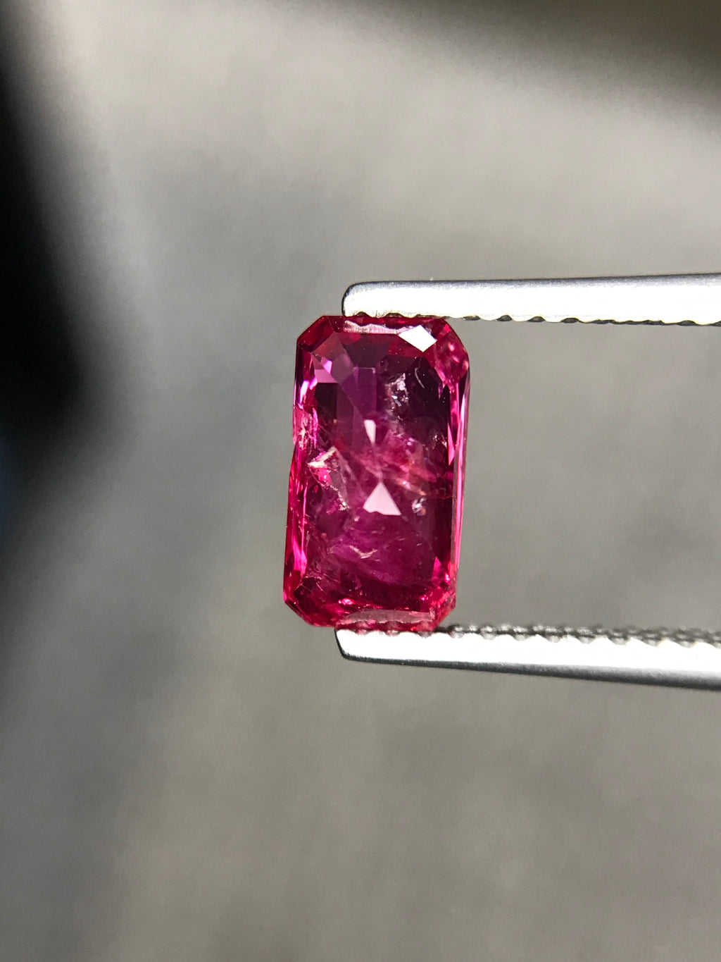 Shiza Gems 2.01 ct unheated emerald-cut ruby, vivid pinkish-red color, natural inclusions, step-cut faceting.