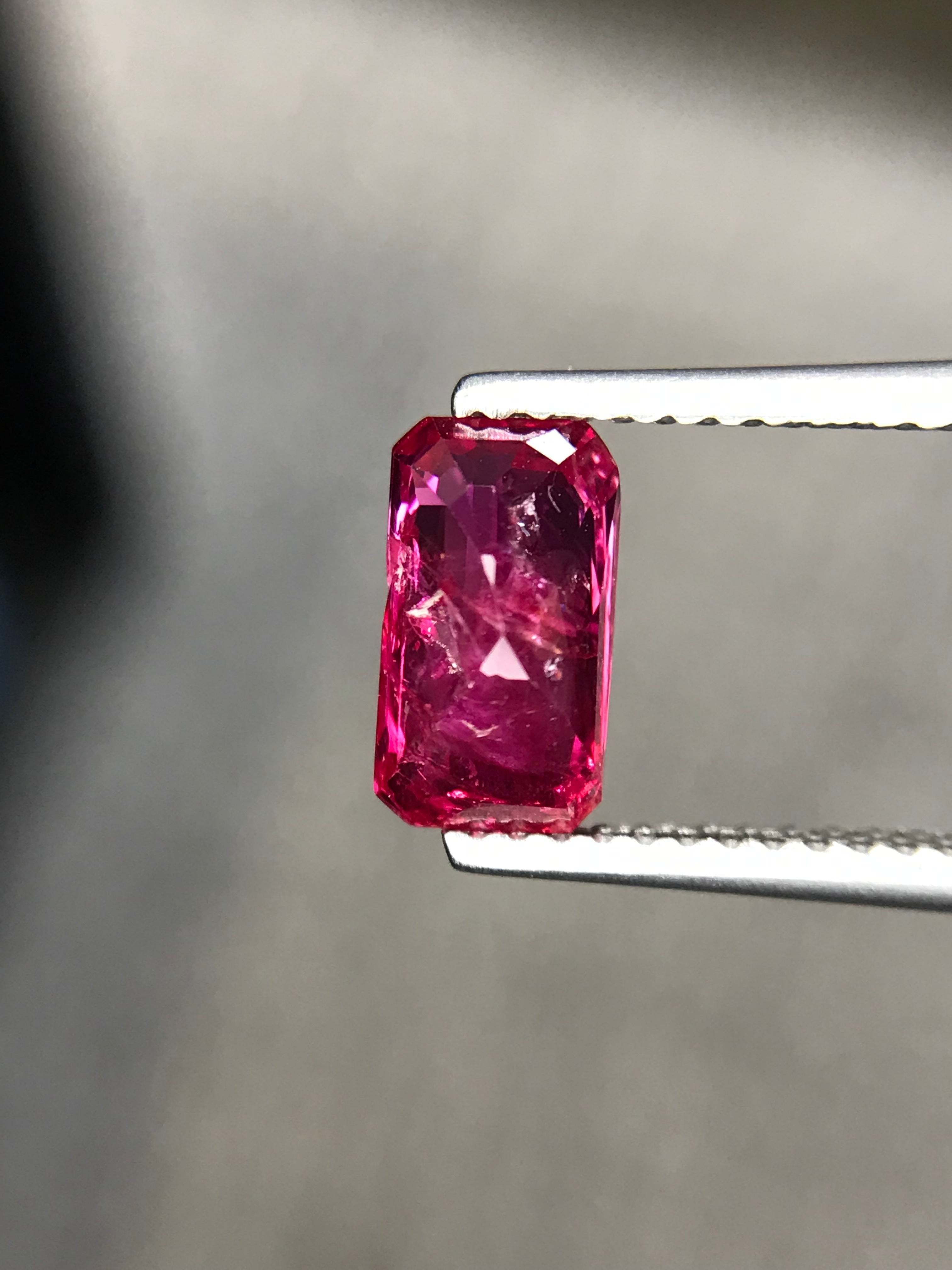 Shiza Gems 2.01 ct unheated emerald-cut ruby, vivid pinkish-red color, natural inclusions, step-cut faceting.