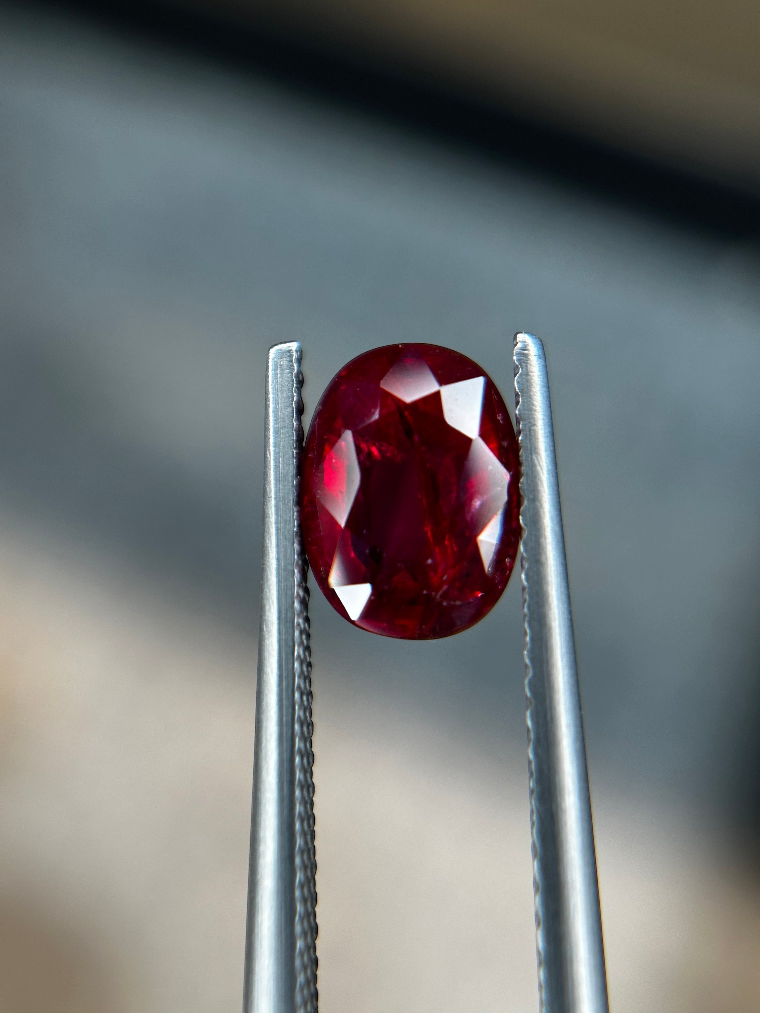 Shiza Gems 2.05 ct oval-cut natural unheated Pigeon Blood ruby, vivid red color, AIGS certified loose gemstone.