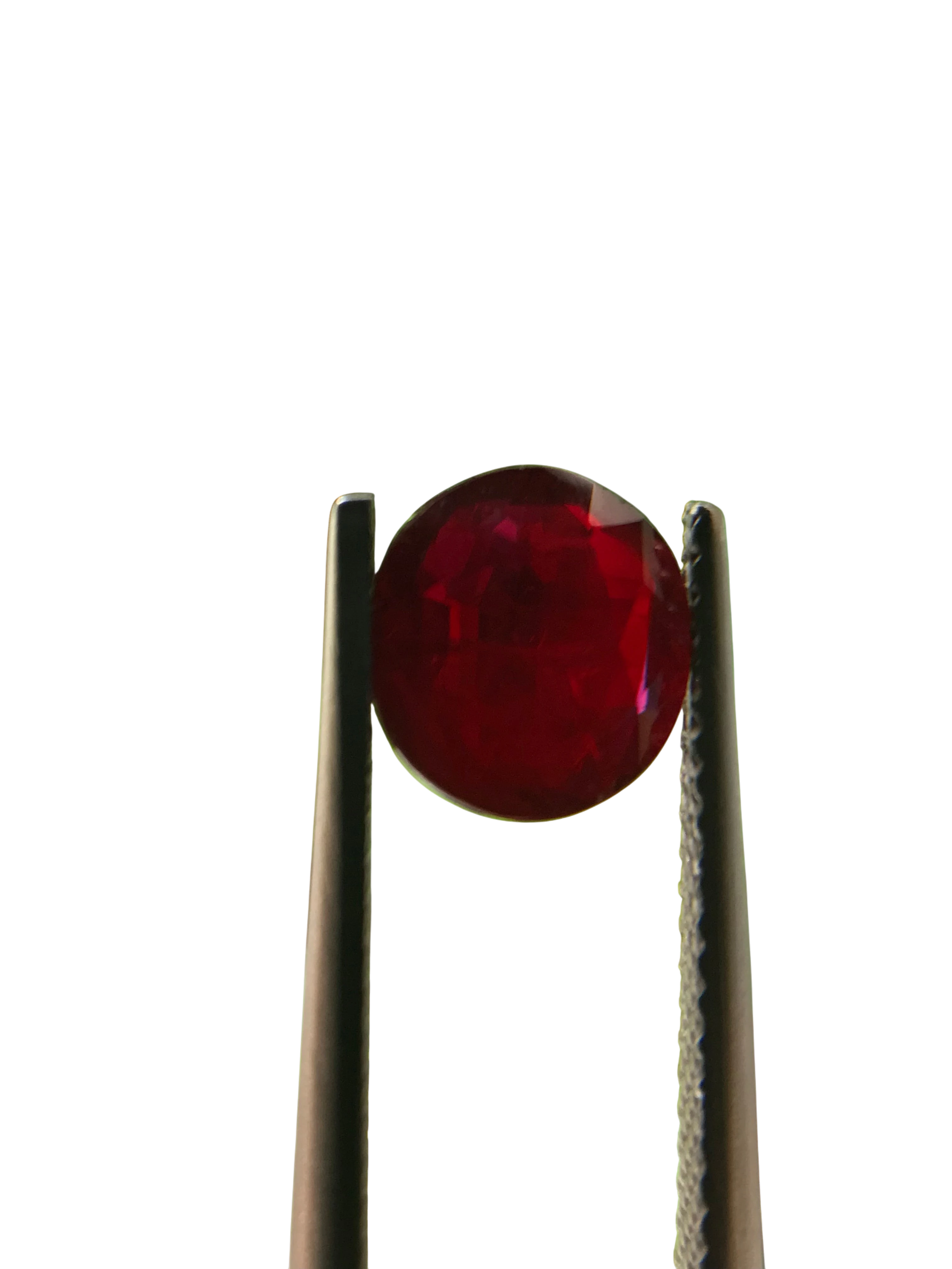 Shiza Gems 2.04 ct round cut vivid red unheated natural ruby gemstone held by tweezers.