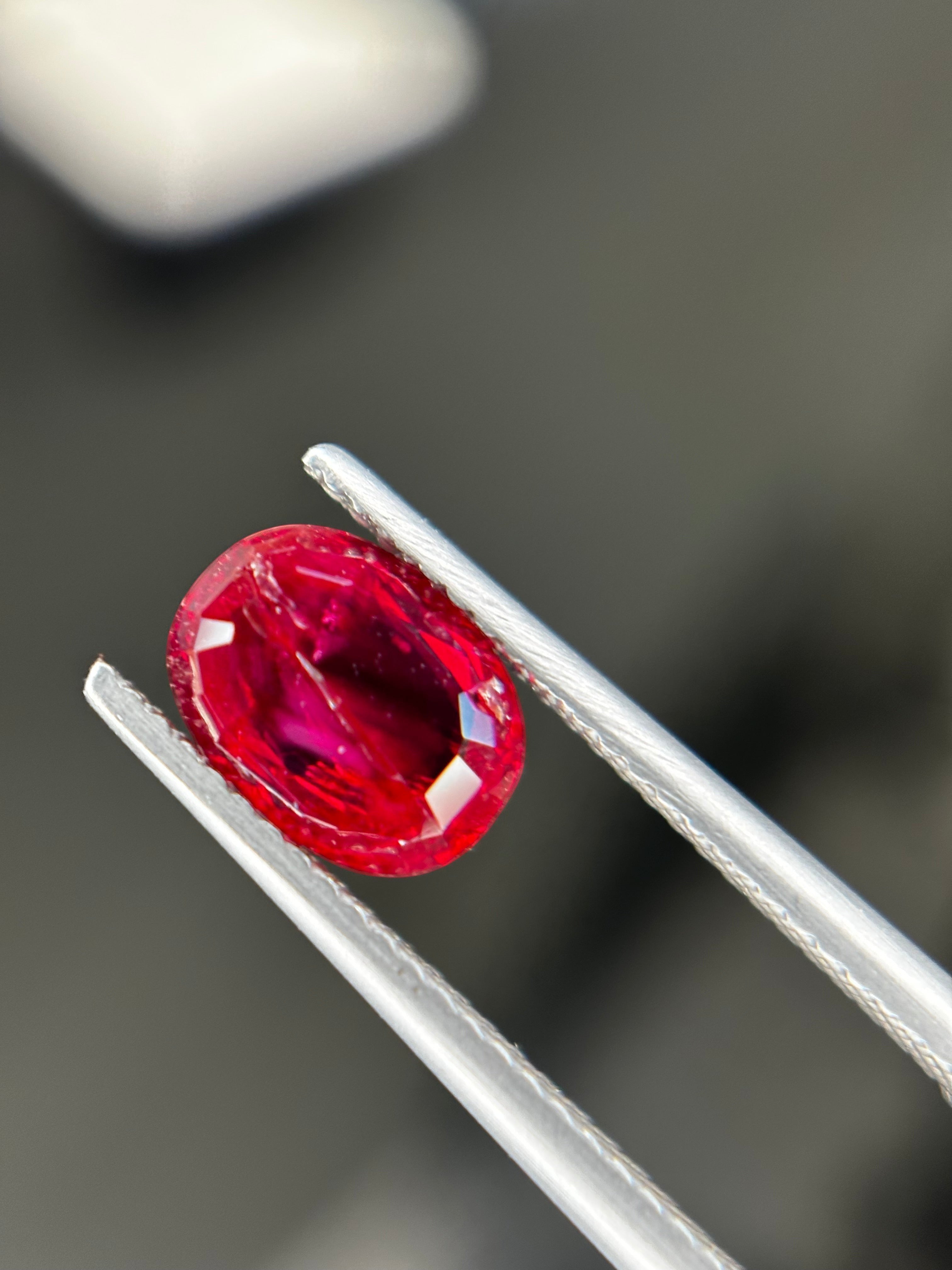 Shiza Gems 2.05 ct oval-cut natural unheated Pigeon Blood ruby, vivid red color, AIGS certified loose gemstone.