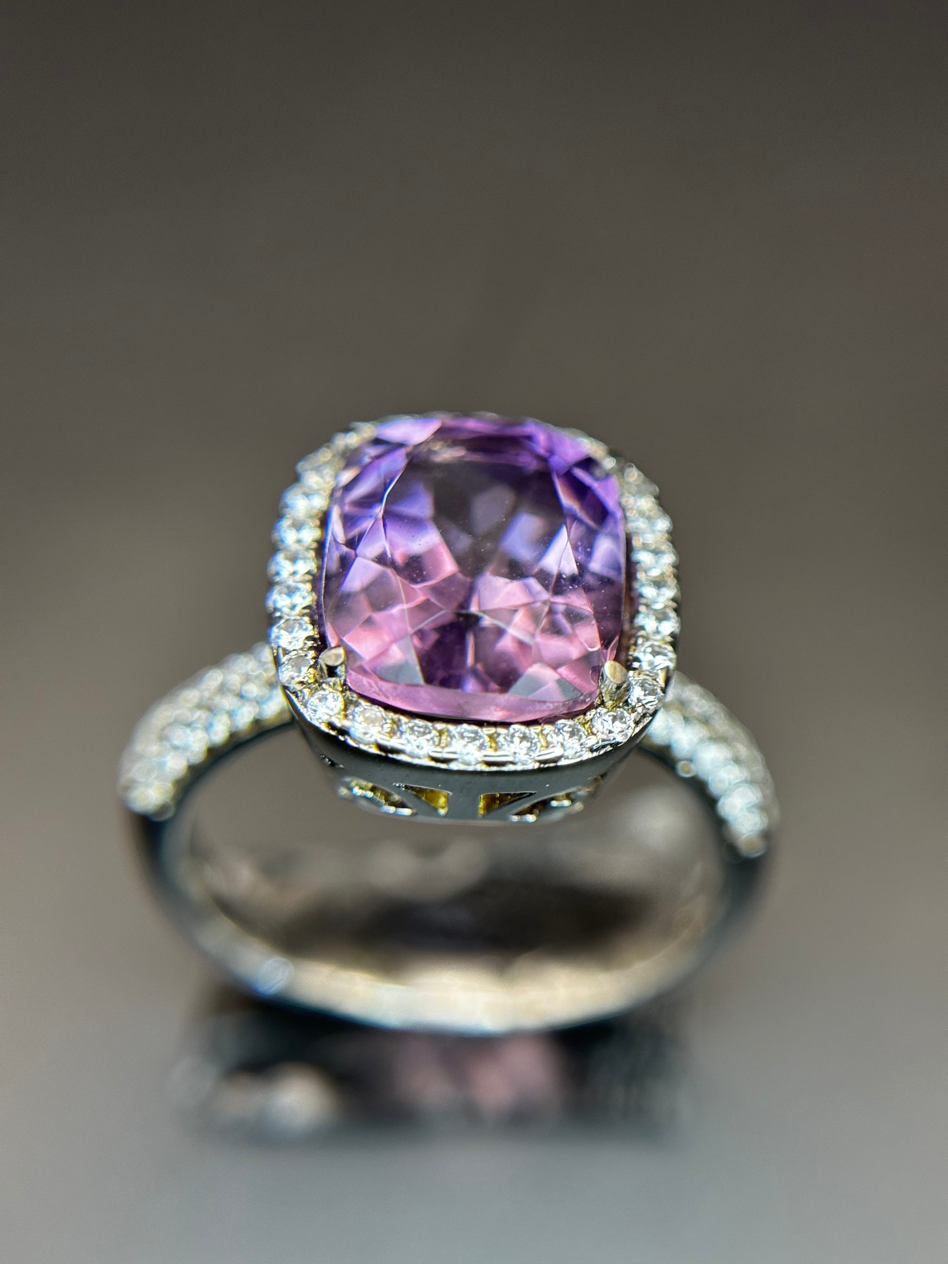 Shiza Gems natural cushion-cut amethyst ring with CZ halo in sterling silver. Soft lavender-purple gemstone with sparkling accents.