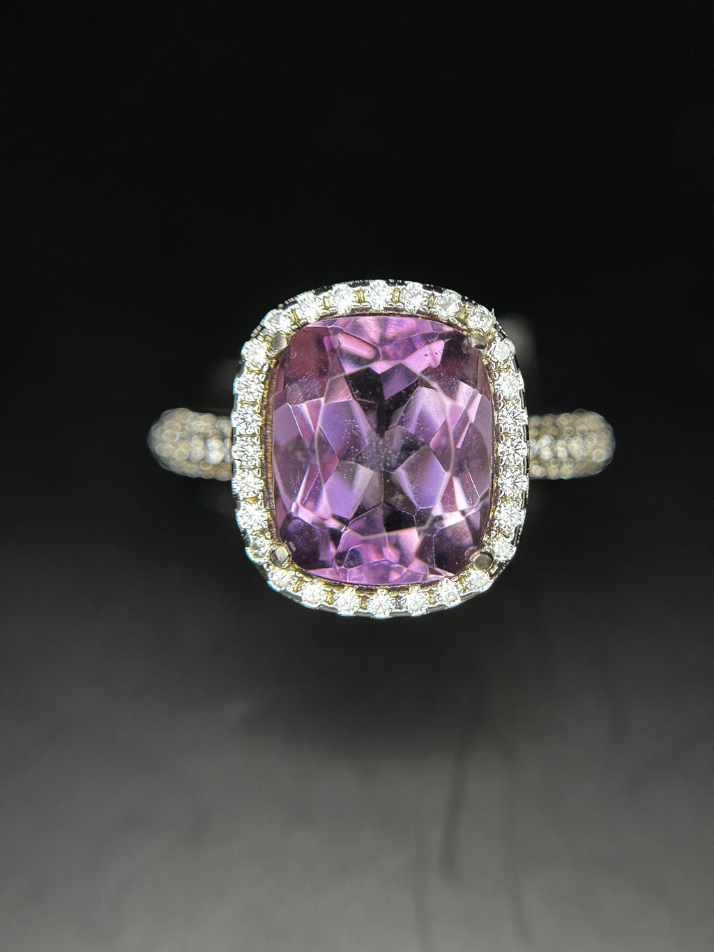 Shiza Gems natural cushion-cut amethyst ring with CZ halo in sterling silver. Soft lavender-purple gemstone surrounded by sparkling cubic zirconia.