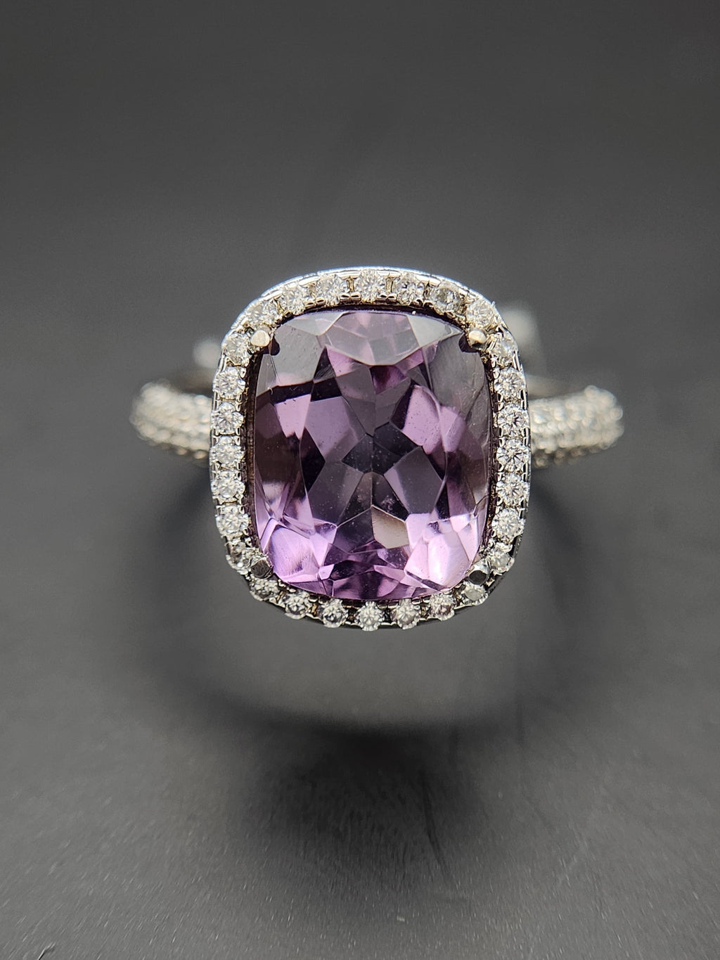Shiza Gems cushion-cut natural amethyst ring with CZ halo in sterling silver. Soft lavender-purple gemstone with sparkling accents.
