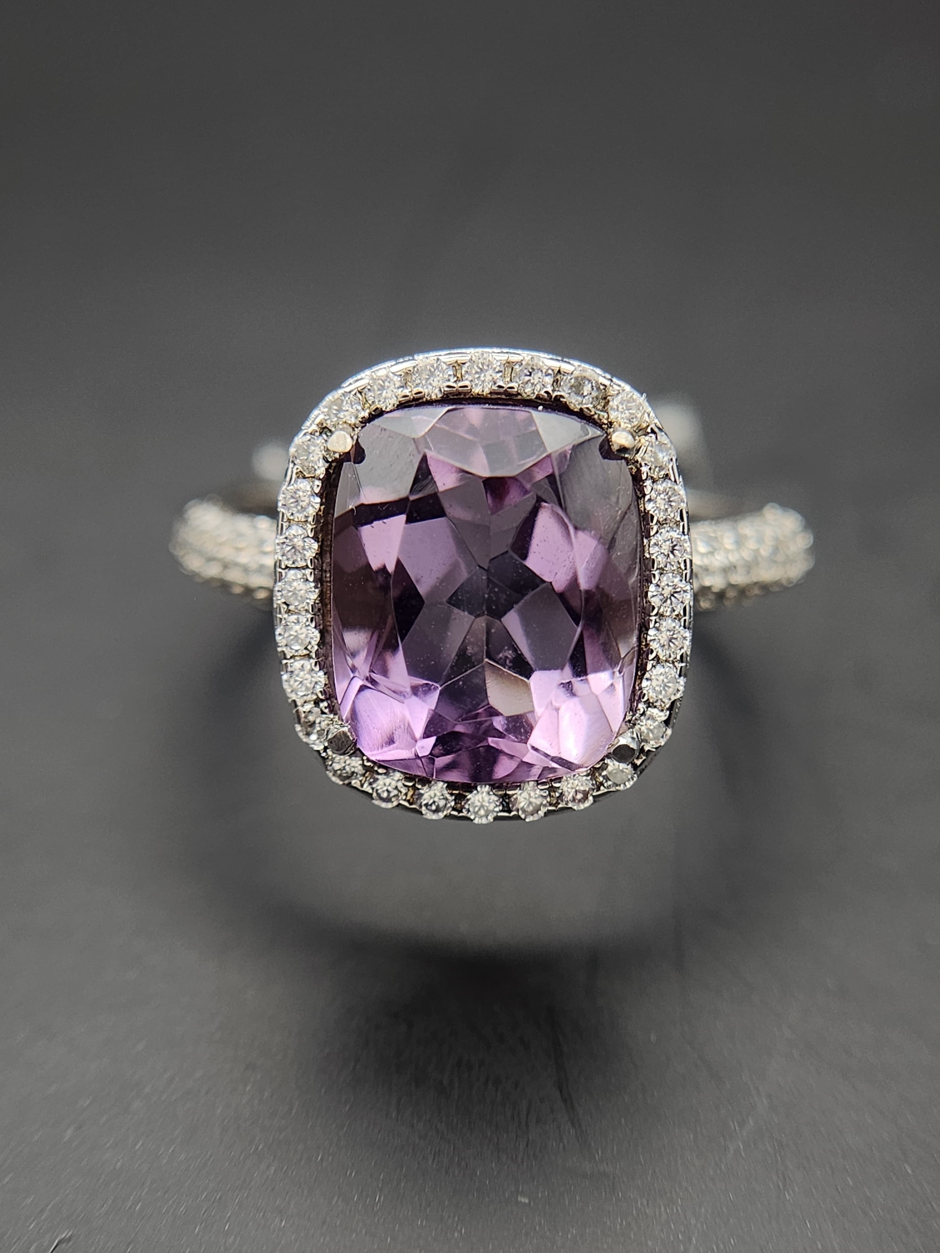 Shiza Gems cushion-cut natural amethyst ring with CZ halo in sterling silver. Soft lavender-purple gemstone with sparkling accents.