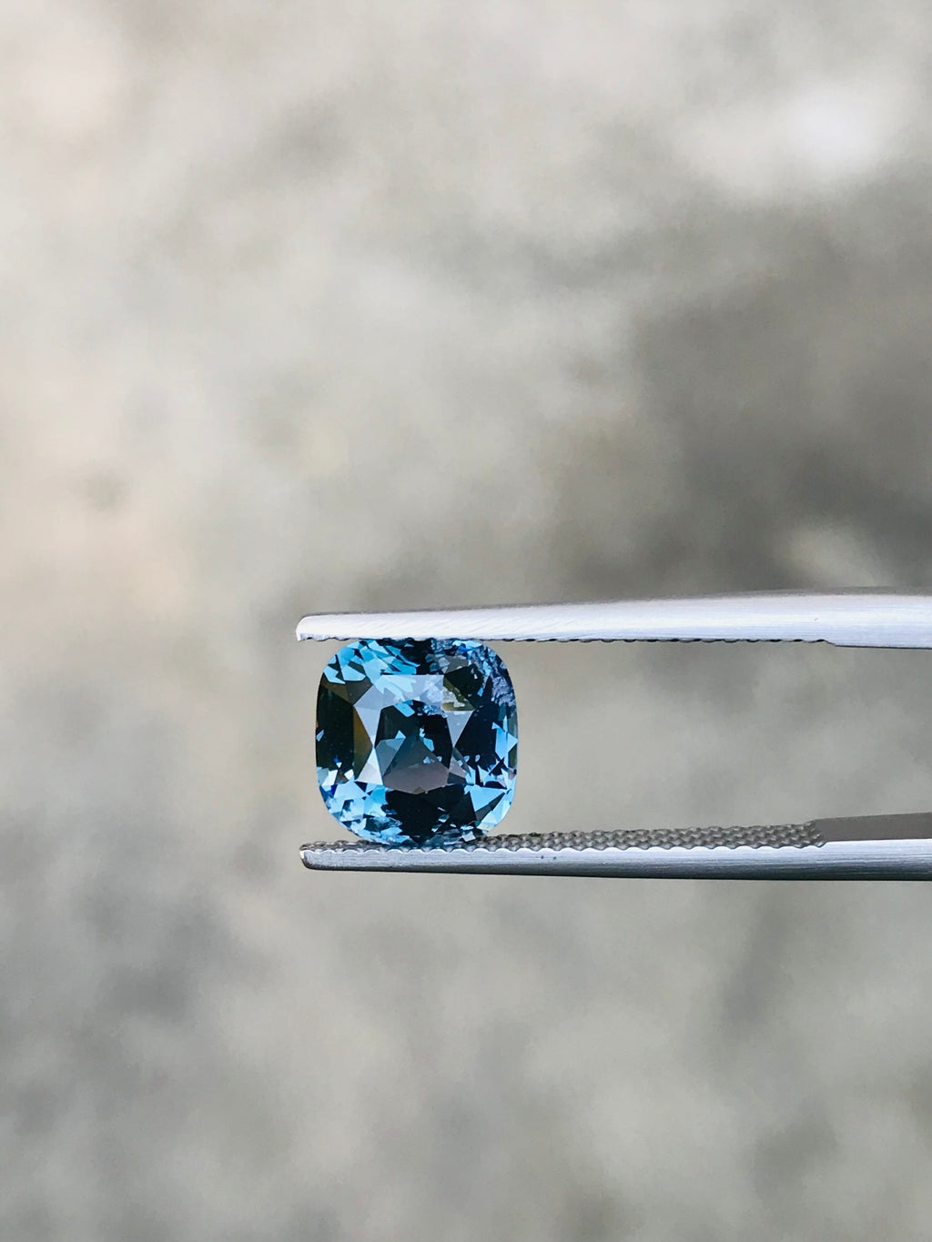 Shiza Gems 2.70 ct cushion cut bi-color spinel gemstone, teal-blue to lighter tones, for custom jewelry.