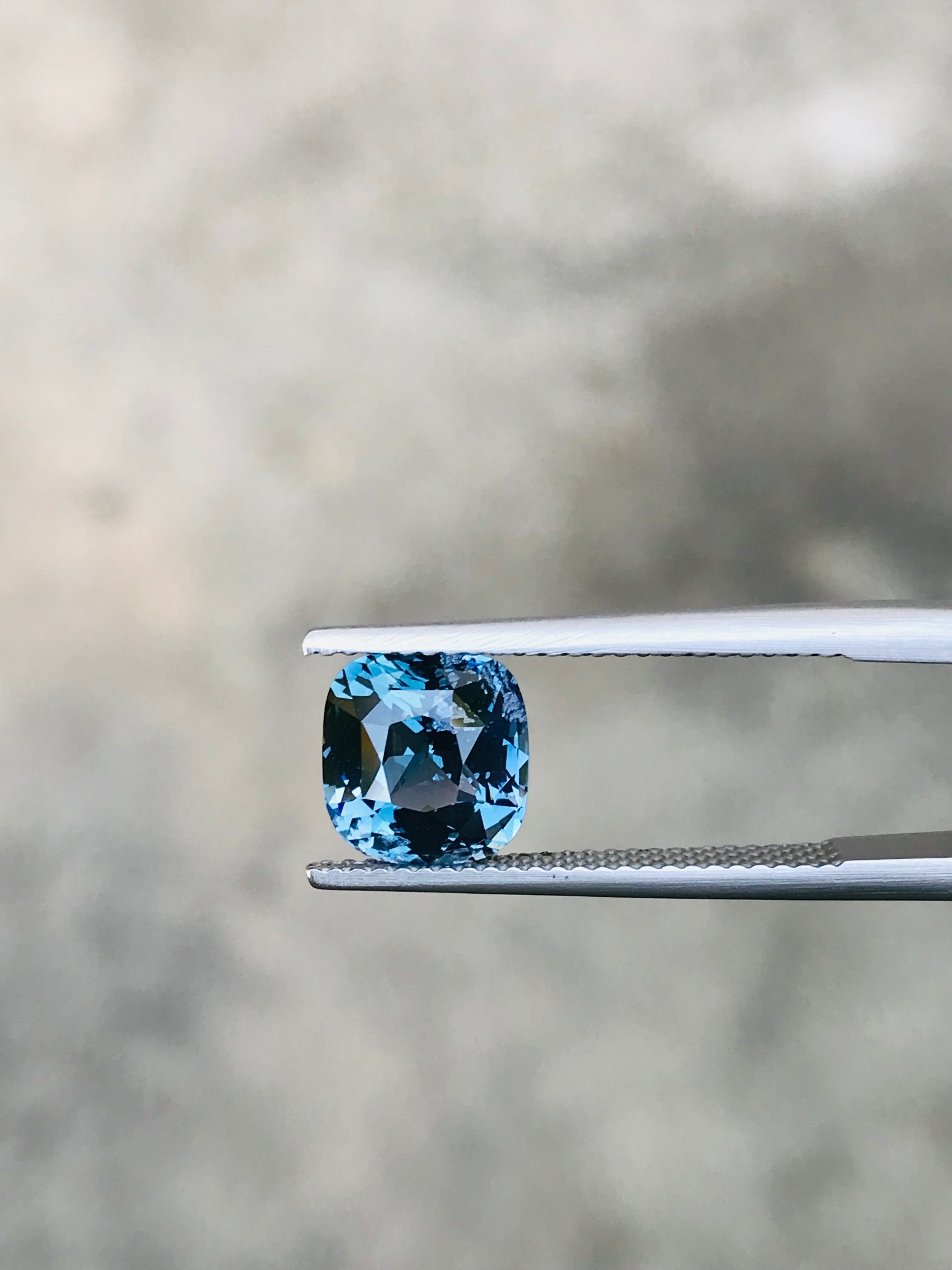 Shiza Gems 2.70 ct cushion cut bi-color spinel gemstone, teal-blue to lighter tones, for custom jewelry.