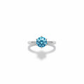 Shiza Gems blue moissanite solitaire ring, round brilliant cut, set in polished sterling silver with a 4-prong setting.