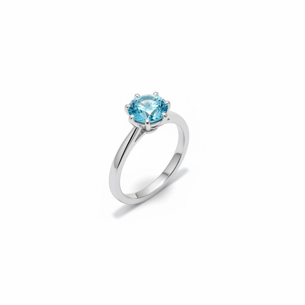Shiza Gems blue moissanite solitaire ring with round brilliant cut center stone in sterling silver.