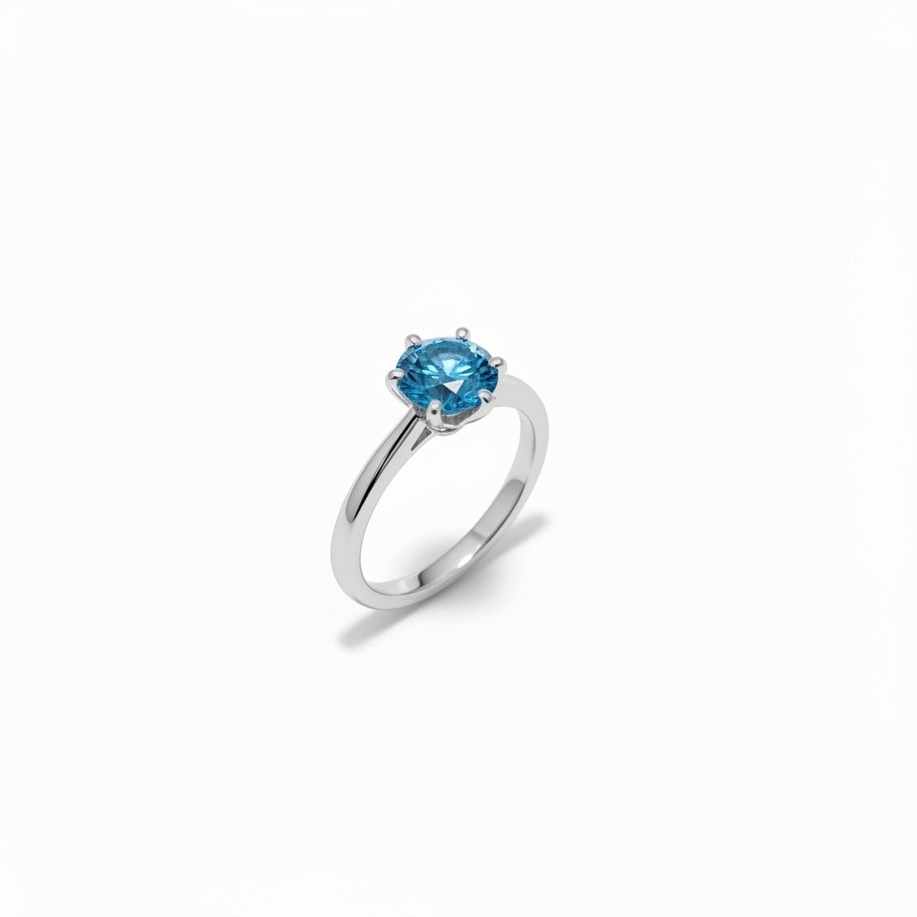 Shiza Gems blue moissanite solitaire ring in sterling silver, round brilliant cut, 4-prong setting.