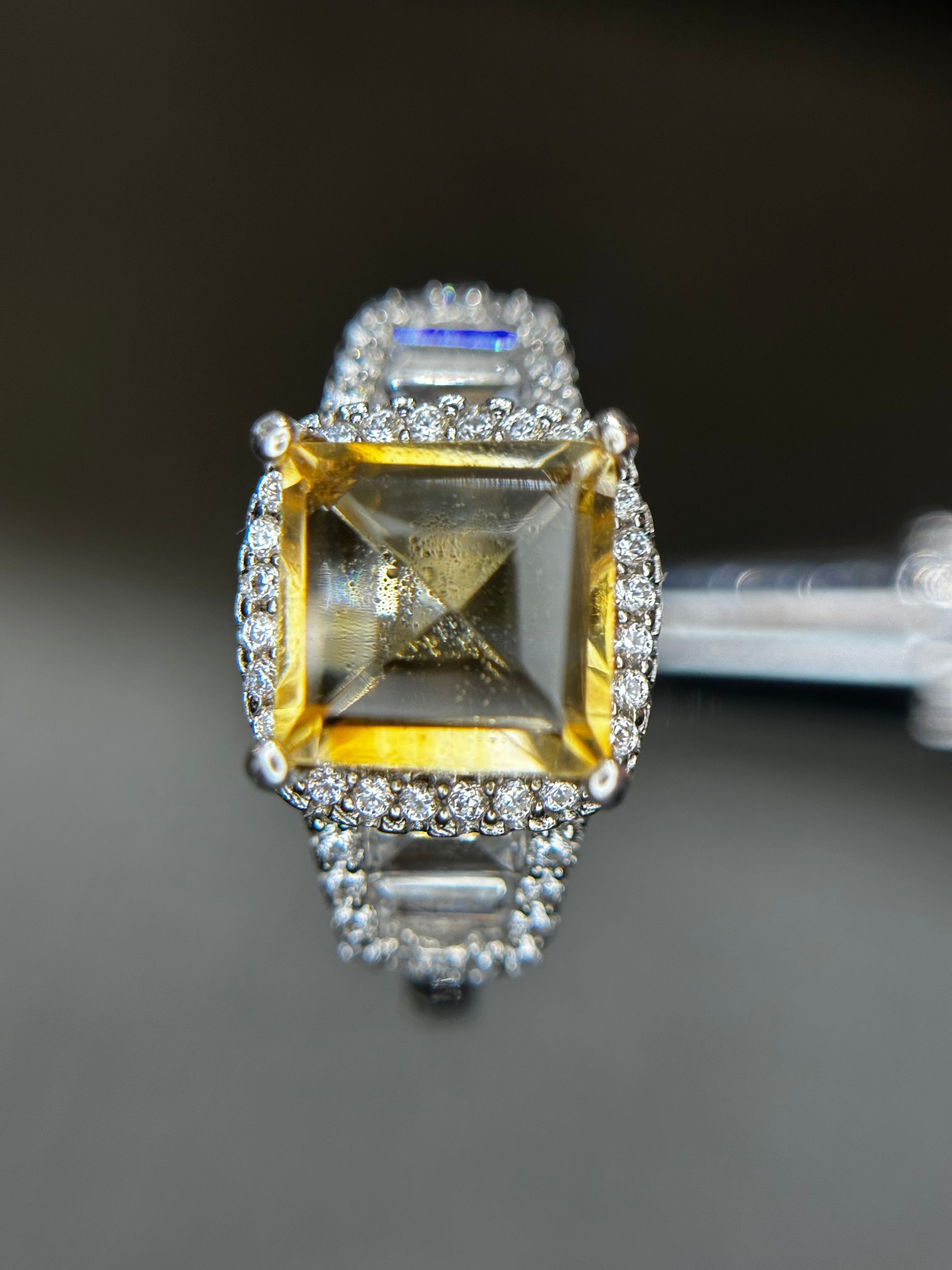 Shiza Gems large emerald-cut golden yellow citrine ring with double halo and baguette accents in sterling silver.