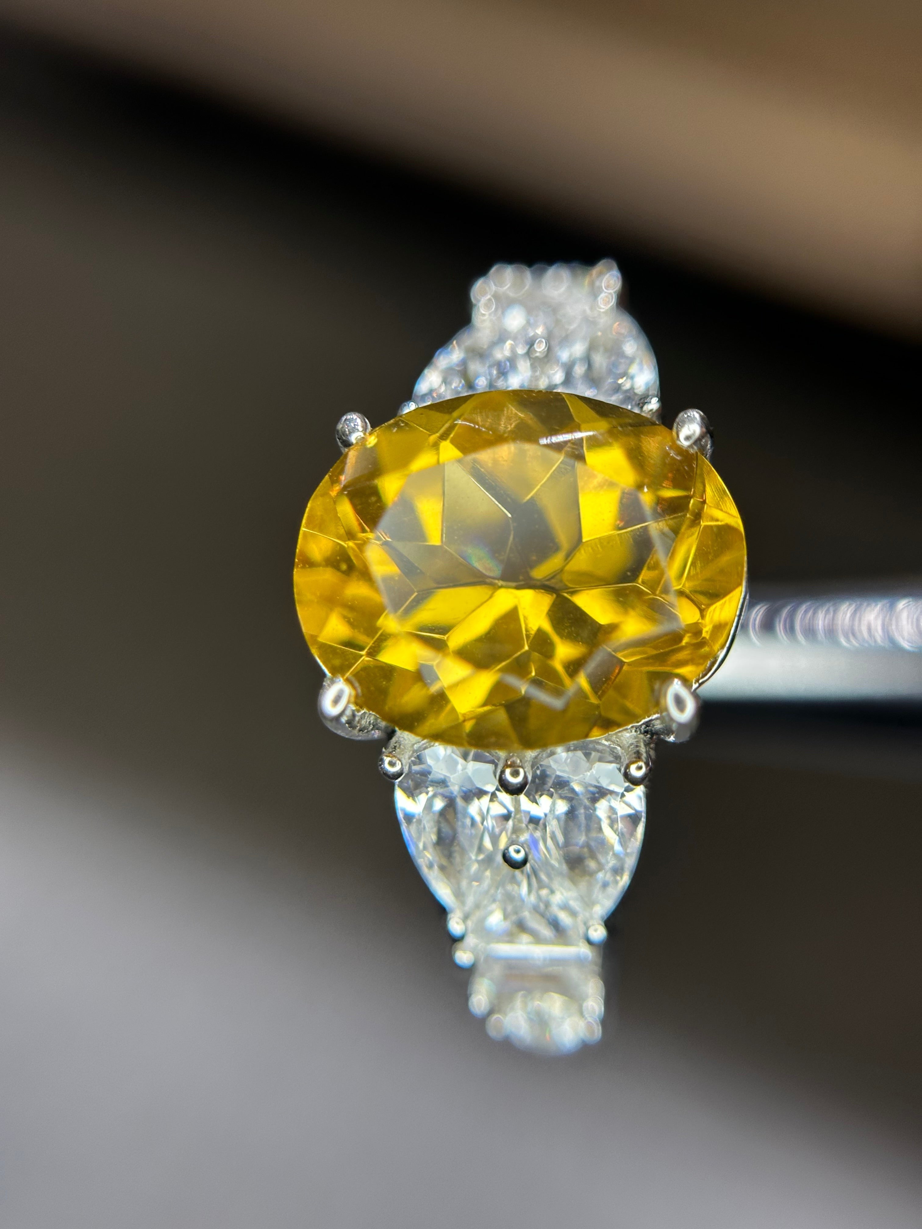 Shiza Gems large oval golden yellow citrine ring with pear-shaped accents and full pavé cubic zirconia in sterling silver.