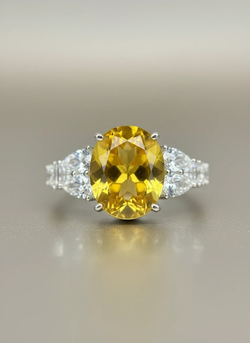 Shiza Gems large oval golden yellow citrine ring with pear-shaped accents and pavé cubic zirconia in sterling silver.