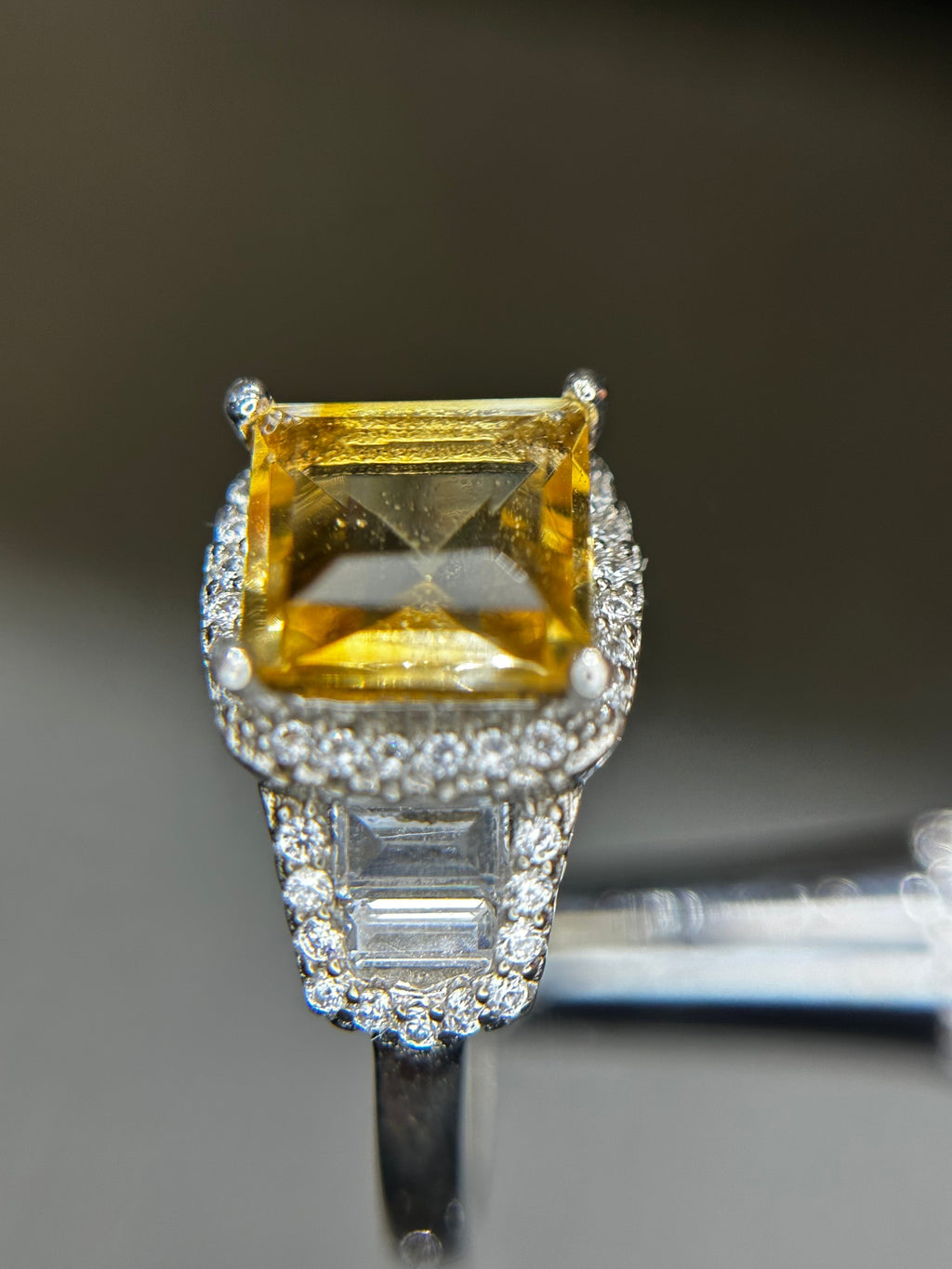 Shiza Gems large emerald-cut golden yellow citrine ring with double halo and baguette accents in sterling silver.