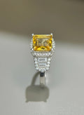 Shiza Gems large emerald-cut golden yellow citrine ring with double halo and baguette accents in sterling silver.