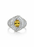 Shiza Gems oval golden yellow citrine ring with double halo of baguette and pavé cubic zirconia in sterling silver.