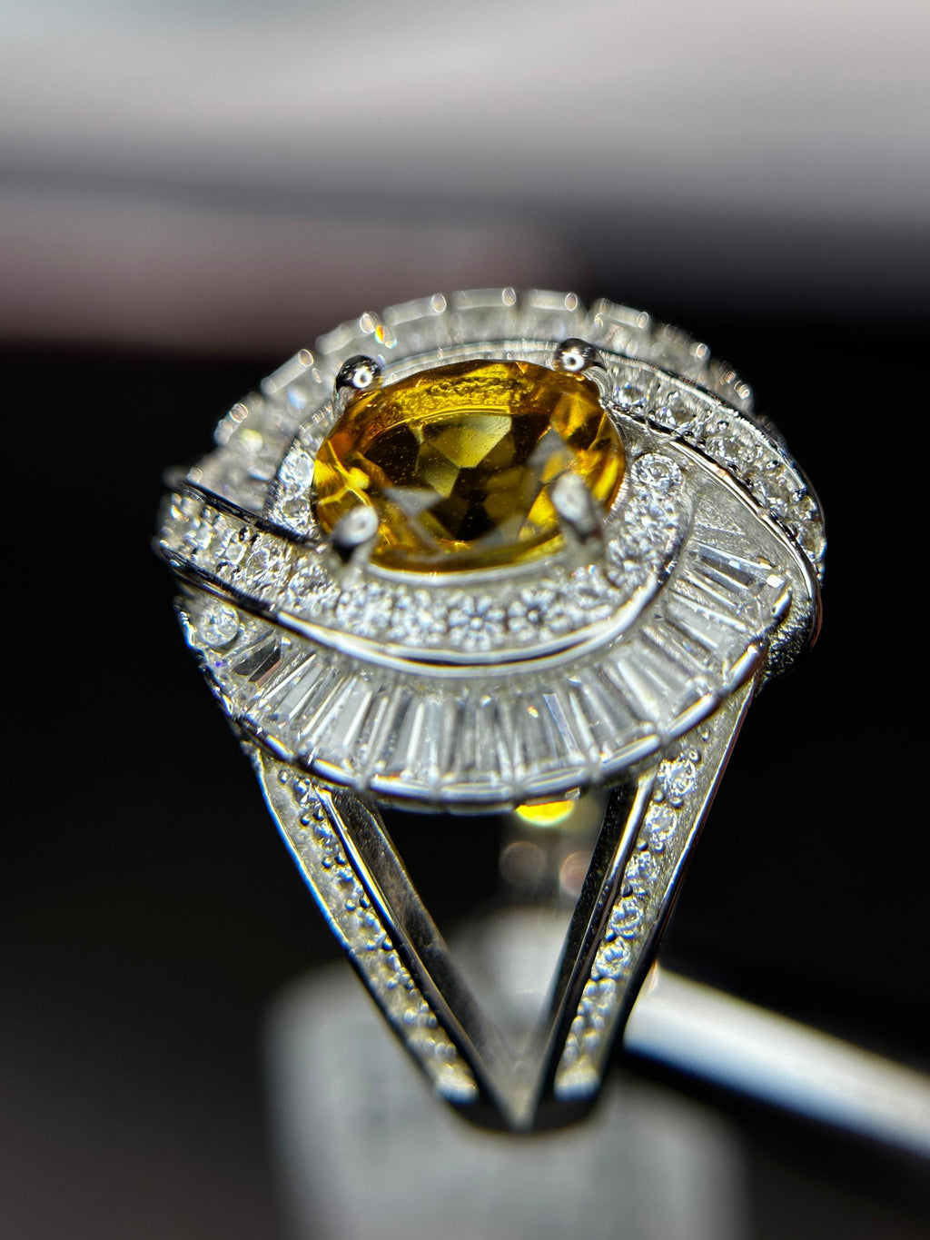 Shiza Gems large oval golden yellow citrine ring with double halo of baguette and pavé cubic zirconia in sterling silver.