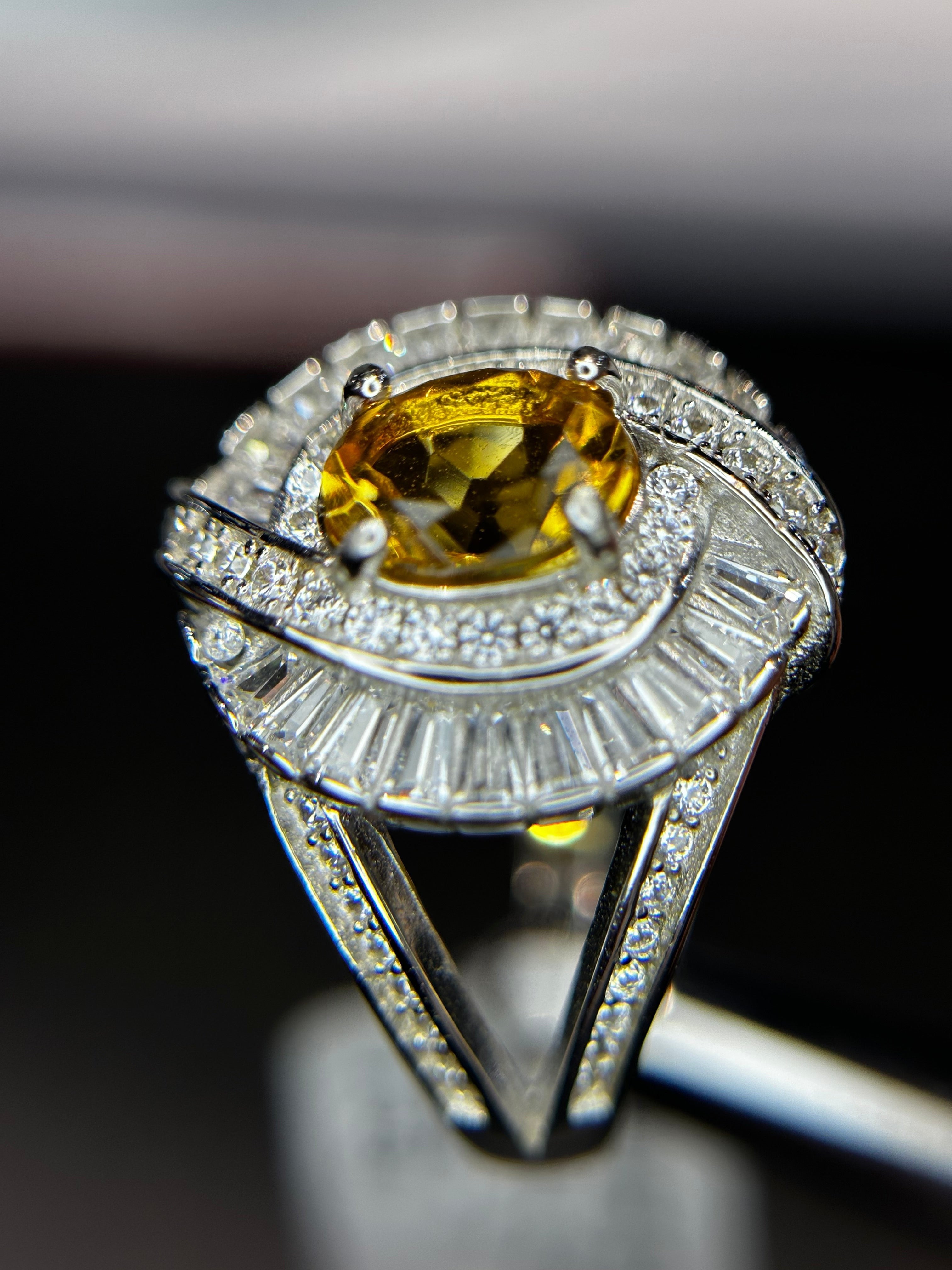 Shiza Gems large oval golden yellow citrine ring with double halo of baguette and pavé cubic zirconia in sterling silver.