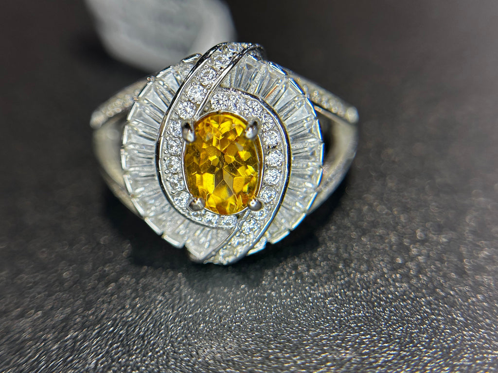 Shiza Gems oval golden yellow citrine ring with double halo of baguette and round cubic zirconia in sterling silver.