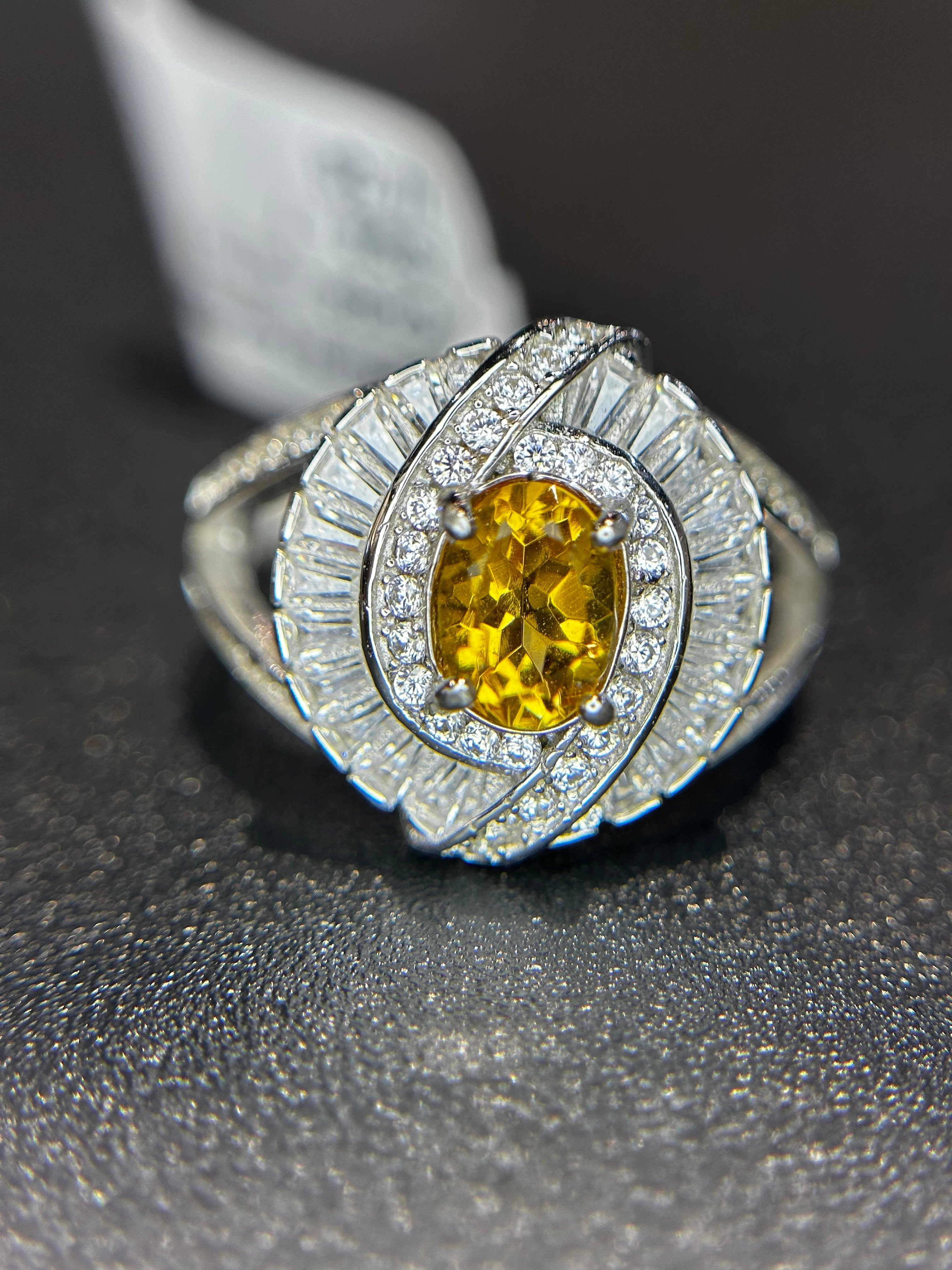 Shiza Gems large oval golden yellow citrine ring with double halo of baguette and pavé cubic zirconia in sterling silver.