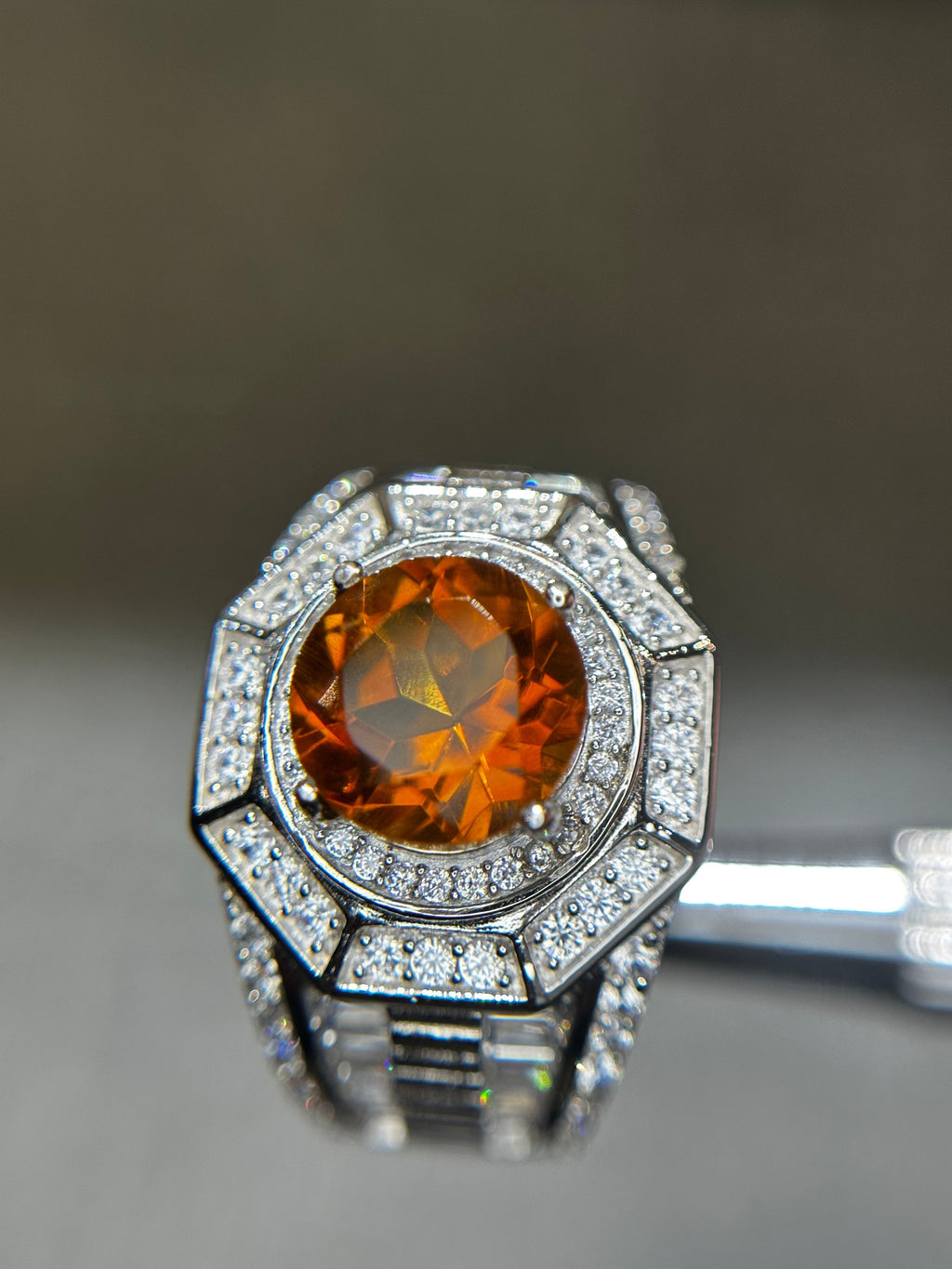 Shiza Gems men's ring with large oval golden-orange citrine, surrounded by pave CZ in sterling silver. Geometric octagonal design.