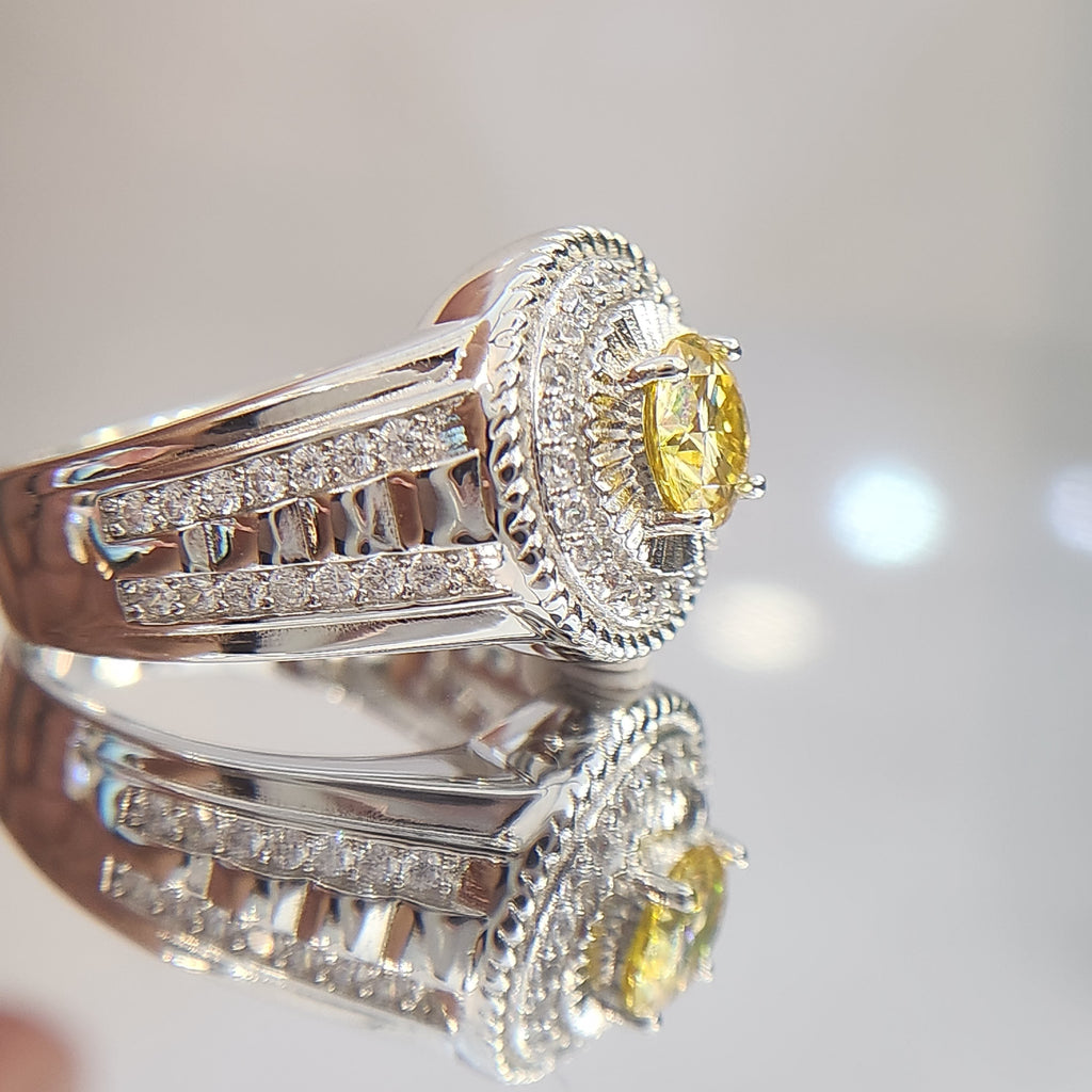 Shiza Gems men's sterling silver ring with round golden yellow moissanite, pavé halo, and green accents.