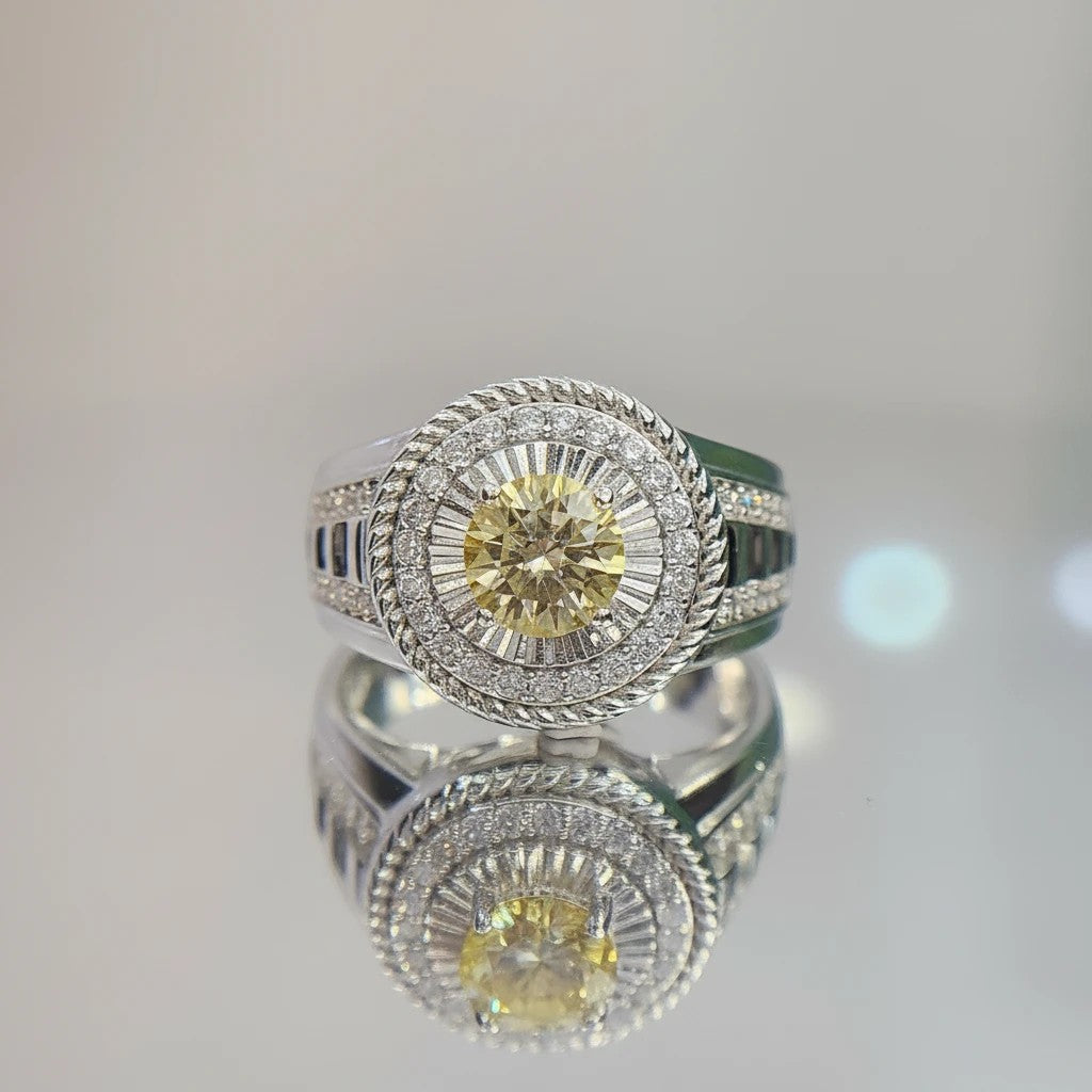 Shiza Gems men's sterling silver ring with round golden yellow moissanite, pavé halo, and green accents.