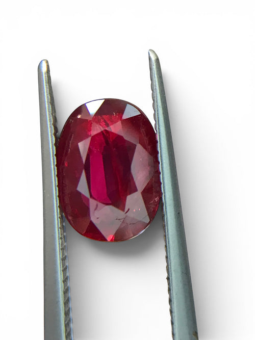 Shiza Gems 2.05 ct oval cut natural unheated pigeon blood ruby, vivid red color, AIGS certified loose gemstone.