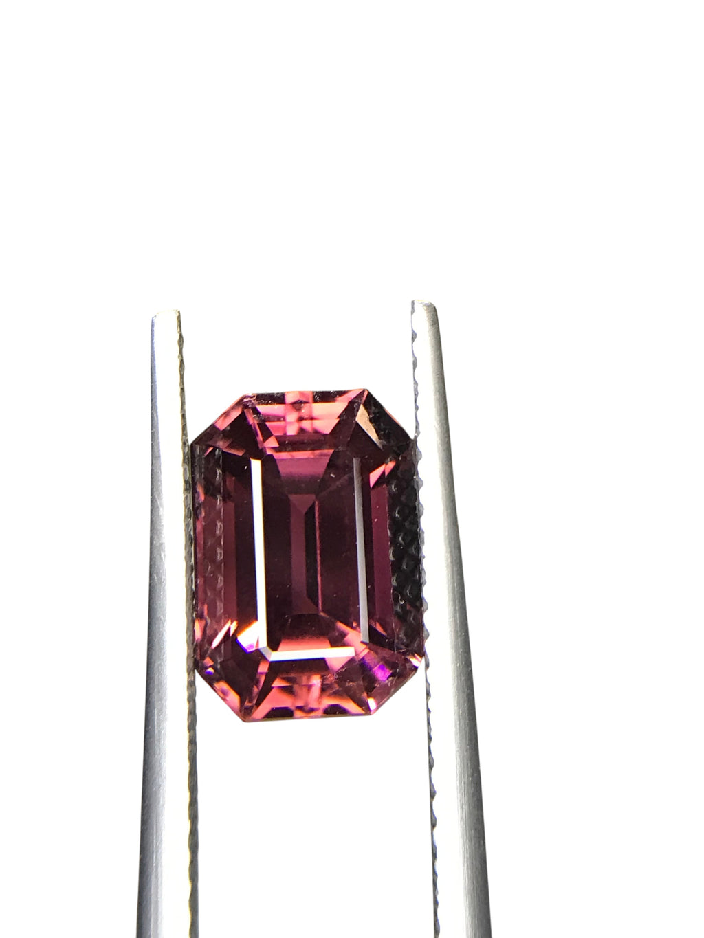 Shiza Gems 3.63ct emerald-cut pink tourmaline gemstone with faceted sides.