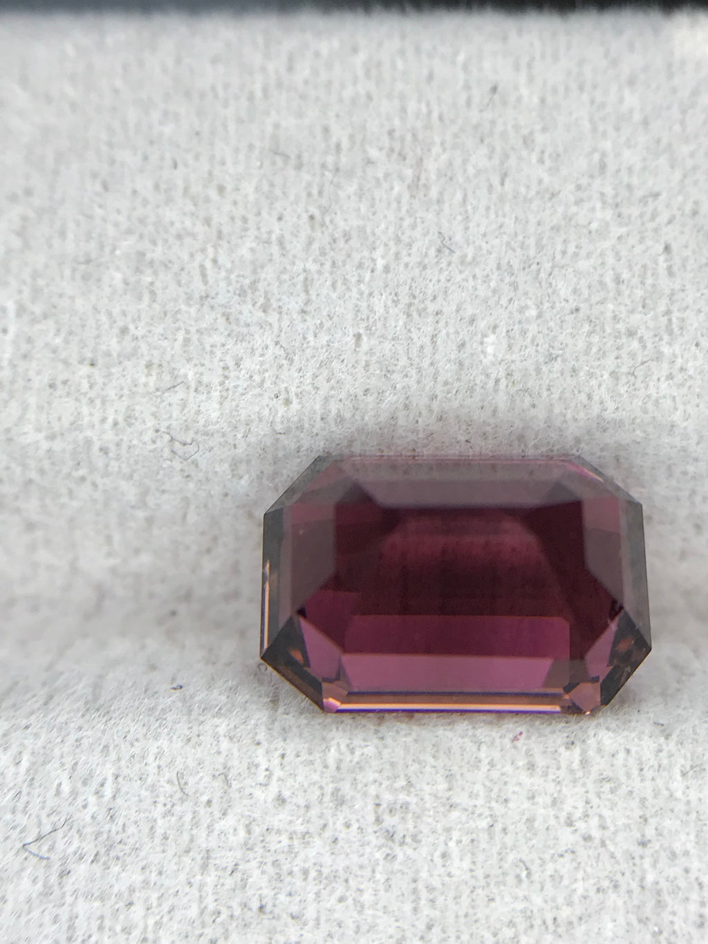 Shiza Gems 3.6 ct emerald-cut natural pink tourmaline gemstone with vivid magenta hue and step faceting.
