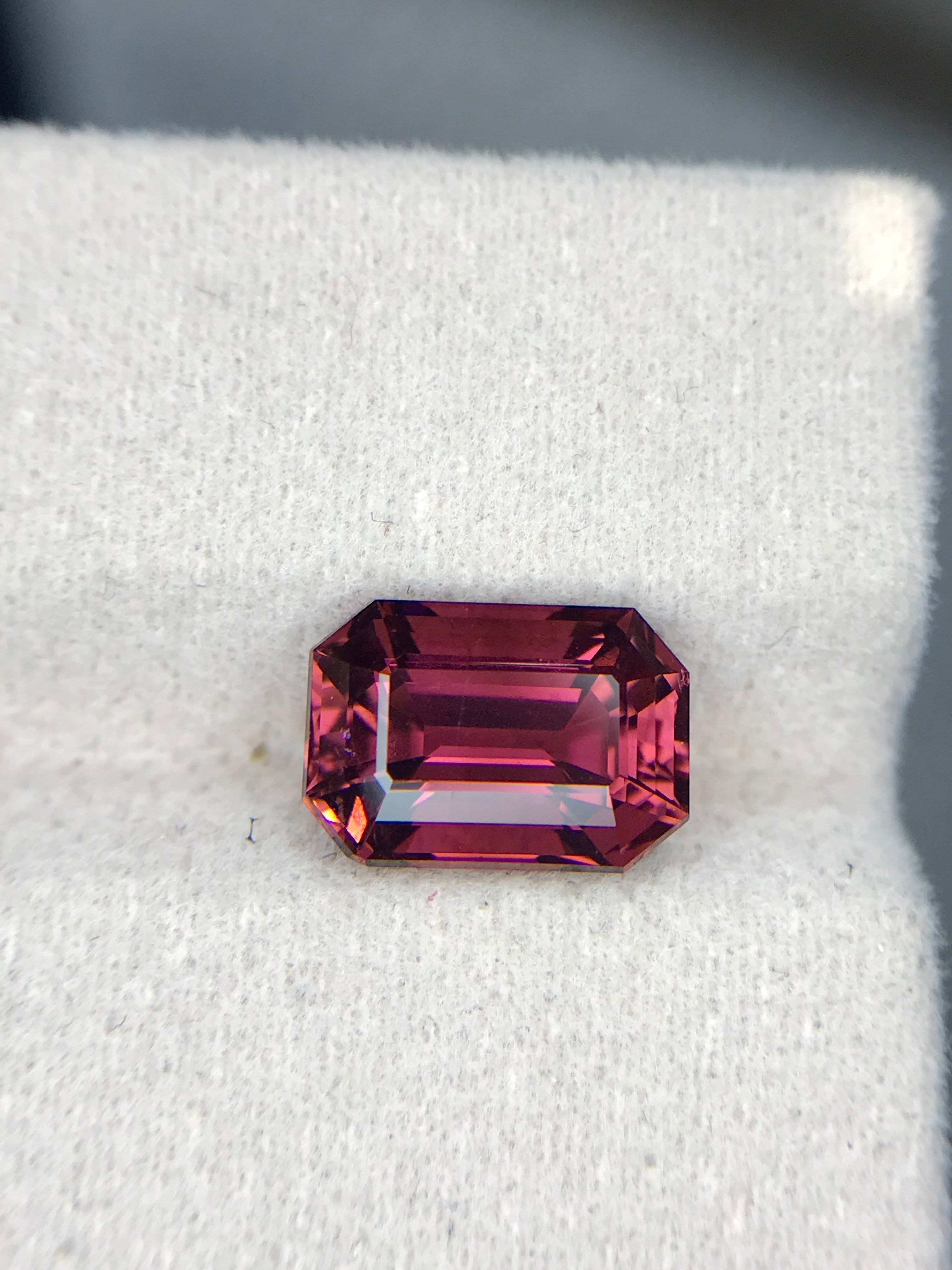 Shiza Gems 3.6 ct natural emerald-cut pink tourmaline gemstone with vivid magenta hue and step faceting.