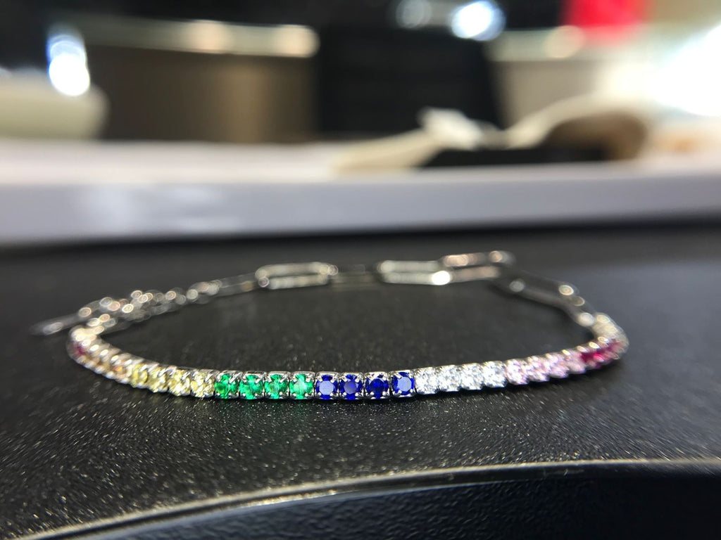 Shiza Gems multi color CZ tennis bracelet in sterling silver with rainbow gemstones including yellow, green, blue, pink, and clear.