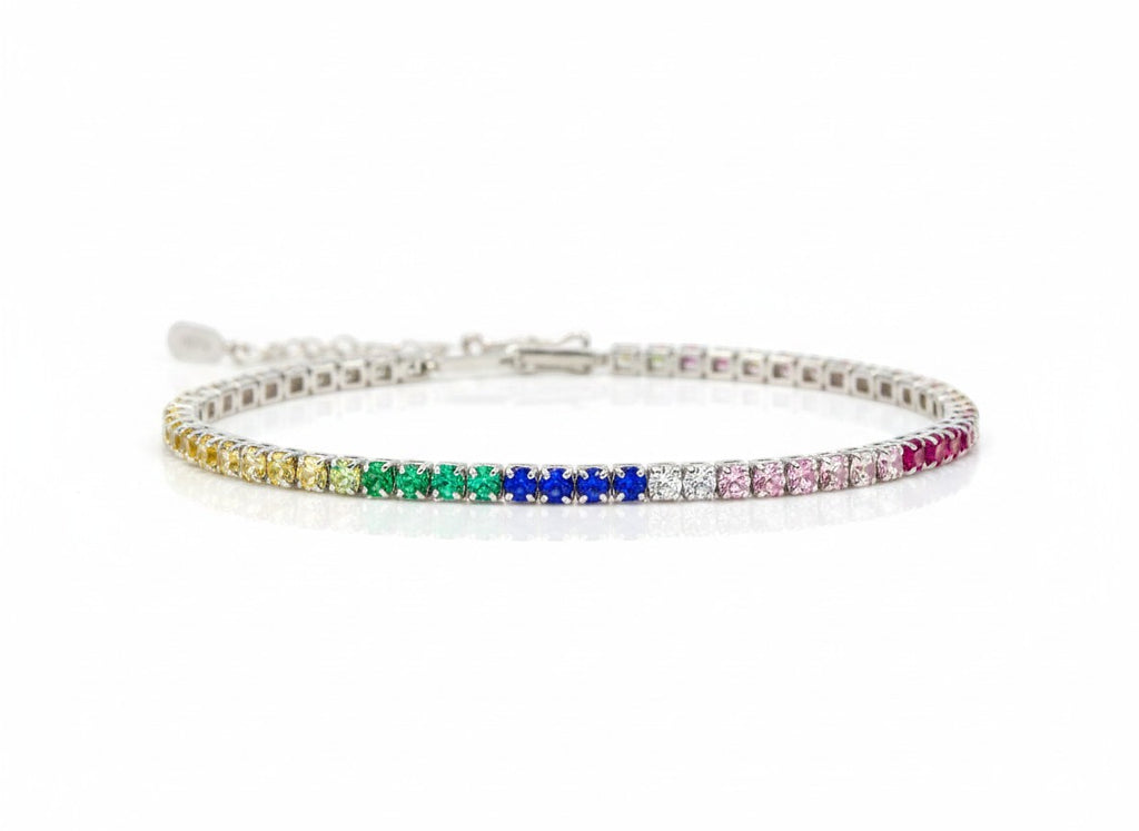 Shiza Gems rainbow multi color CZ tennis bracelet in sterling silver with yellow, green, blue, pink, and clear stones.