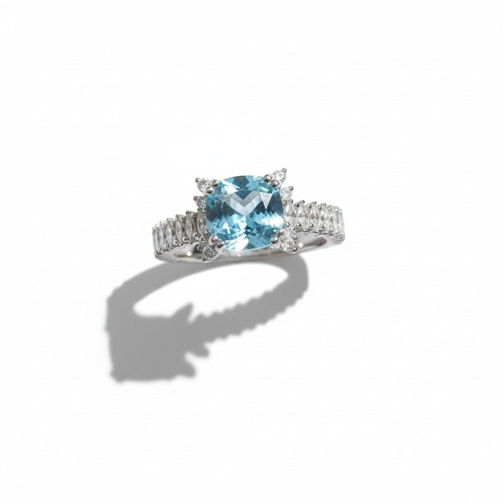 Shiza Gems Cushion-cut sky blue topaz ring with marquise accent stones in 925 silver.