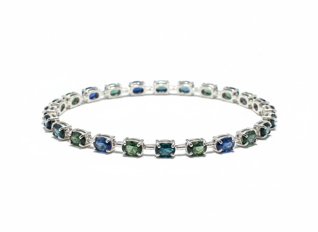 Shiza Gems oval teal sapphire and cubic zirconia tennis bracelet in sterling silver.