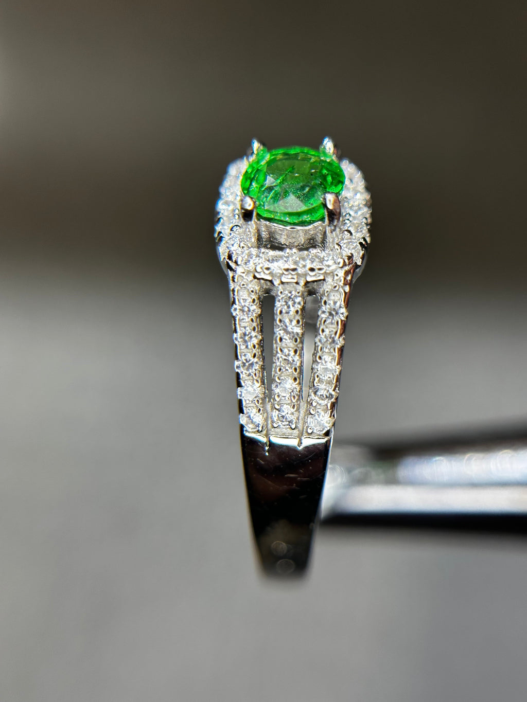 Shiza Gems natural round tsavorite garnet ring with square halo and split shank in sterling silver.