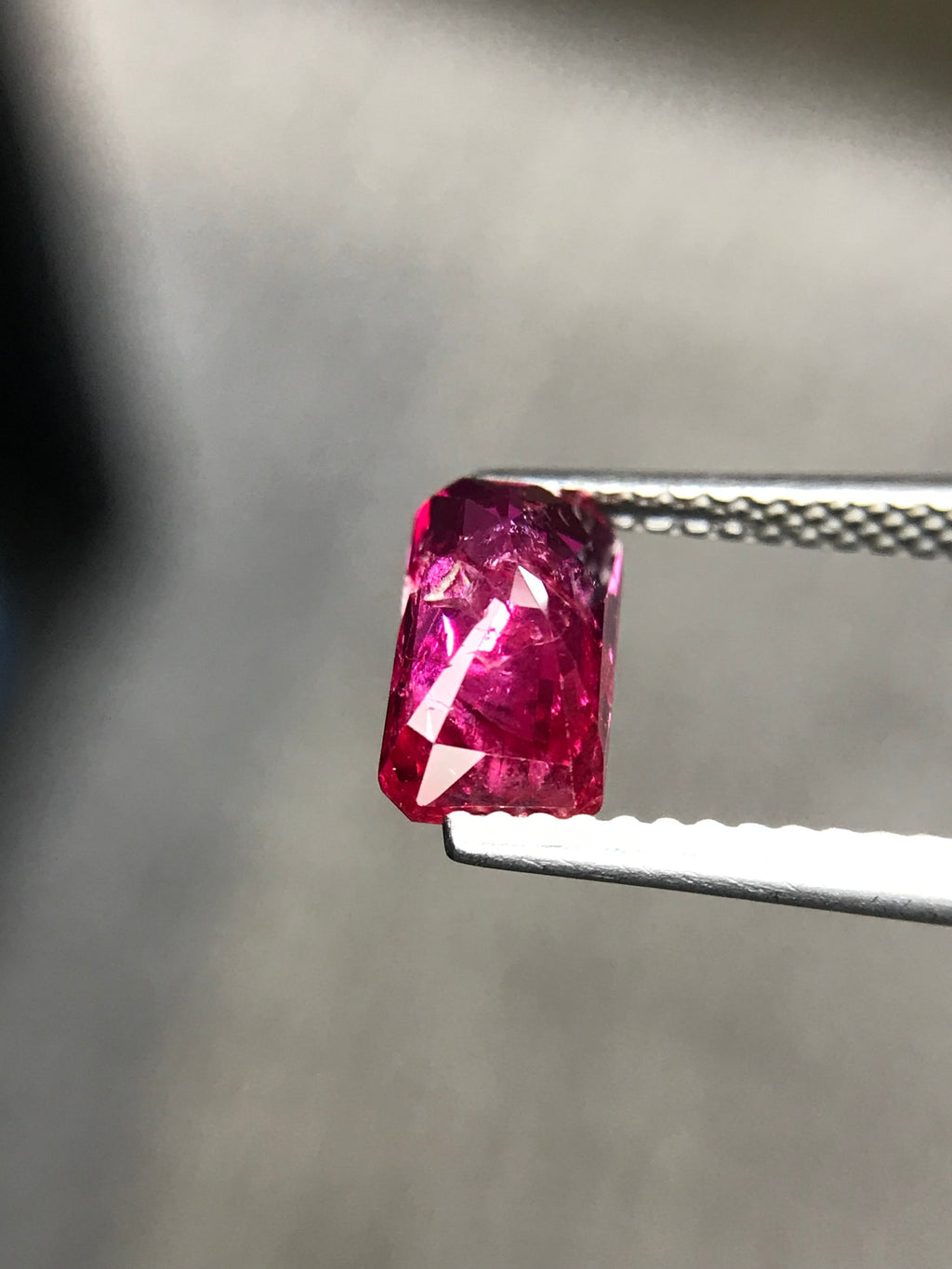 Shiza Gems 2.01 ct emerald-cut vivid pinkish-red unheated ruby gemstone with step faceting.